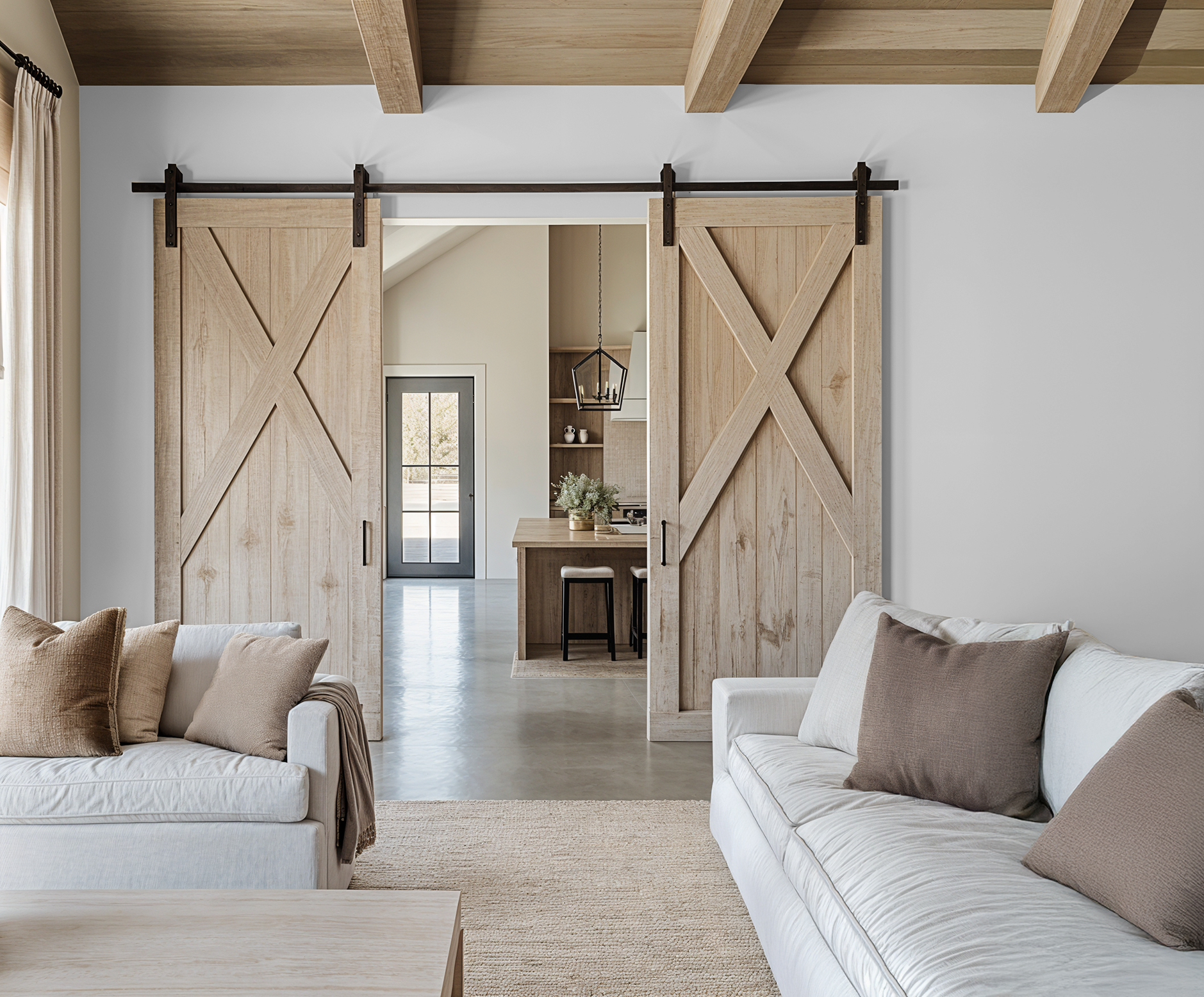 Living room with wooden sliding doors and white furniture