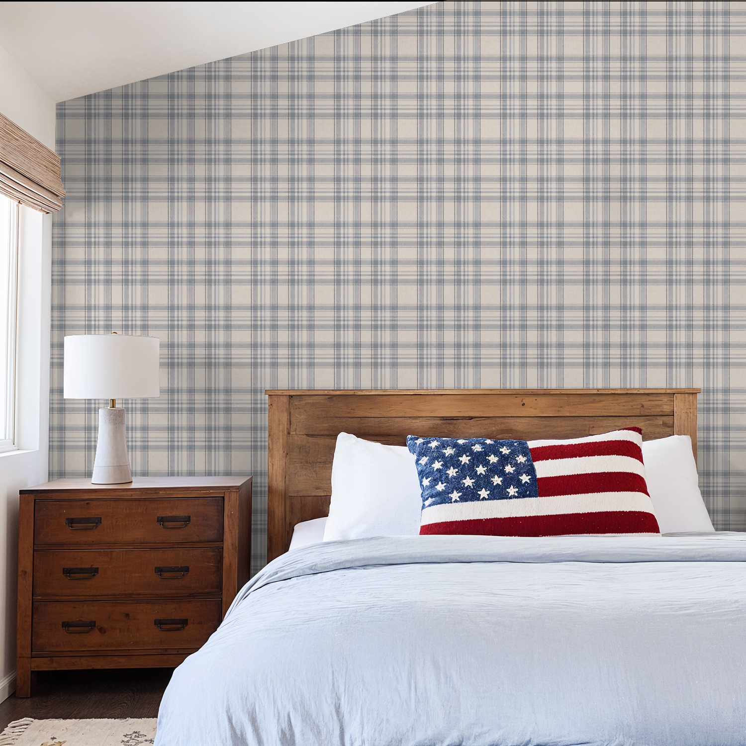 Bedroom with Tweed Plaid - Navy Blues wallpaper, wooden headboard, and American flag pillow.