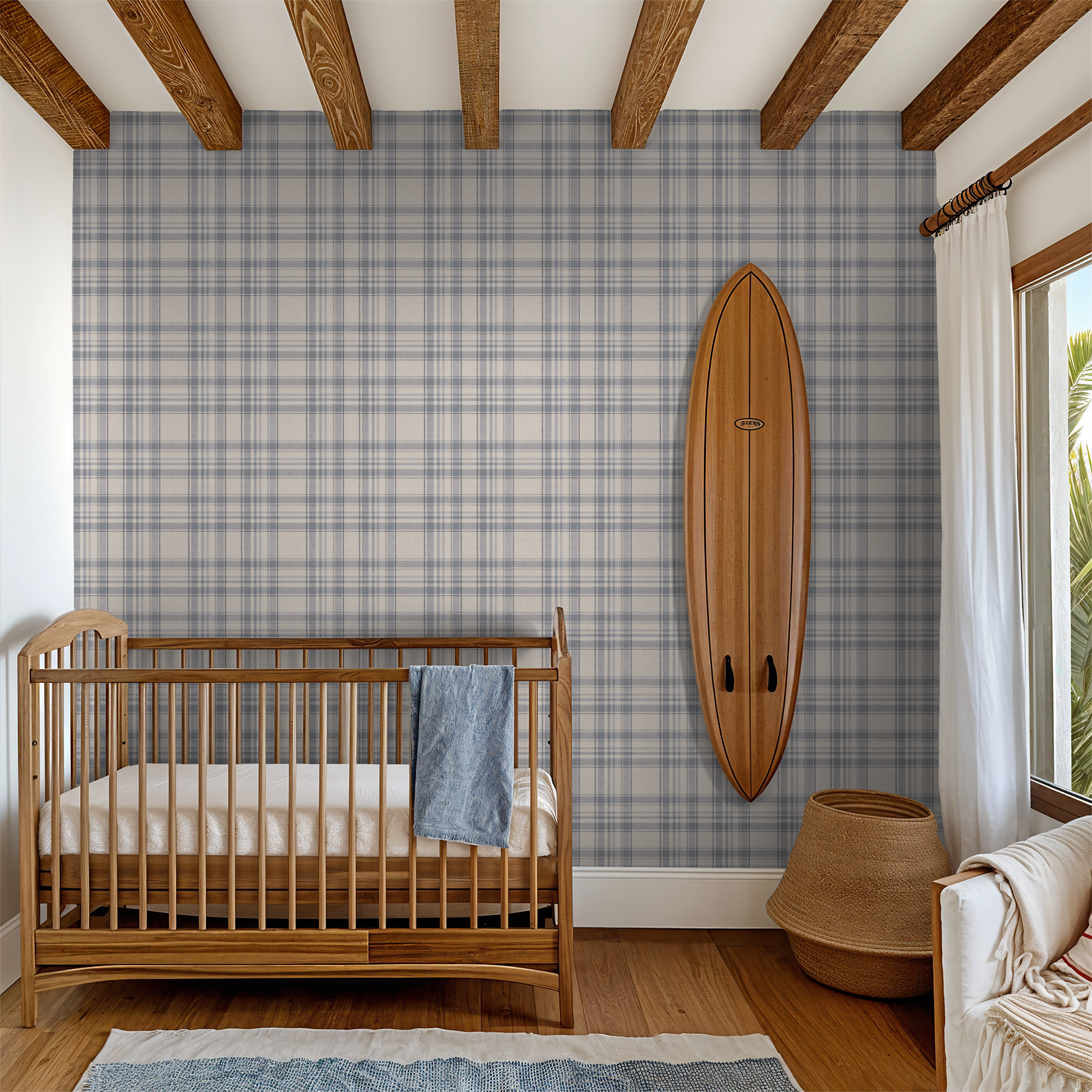 Nursery room with wooden crib, Tweed Plaid - Navy Blues wallpaper, and surfboard decor.