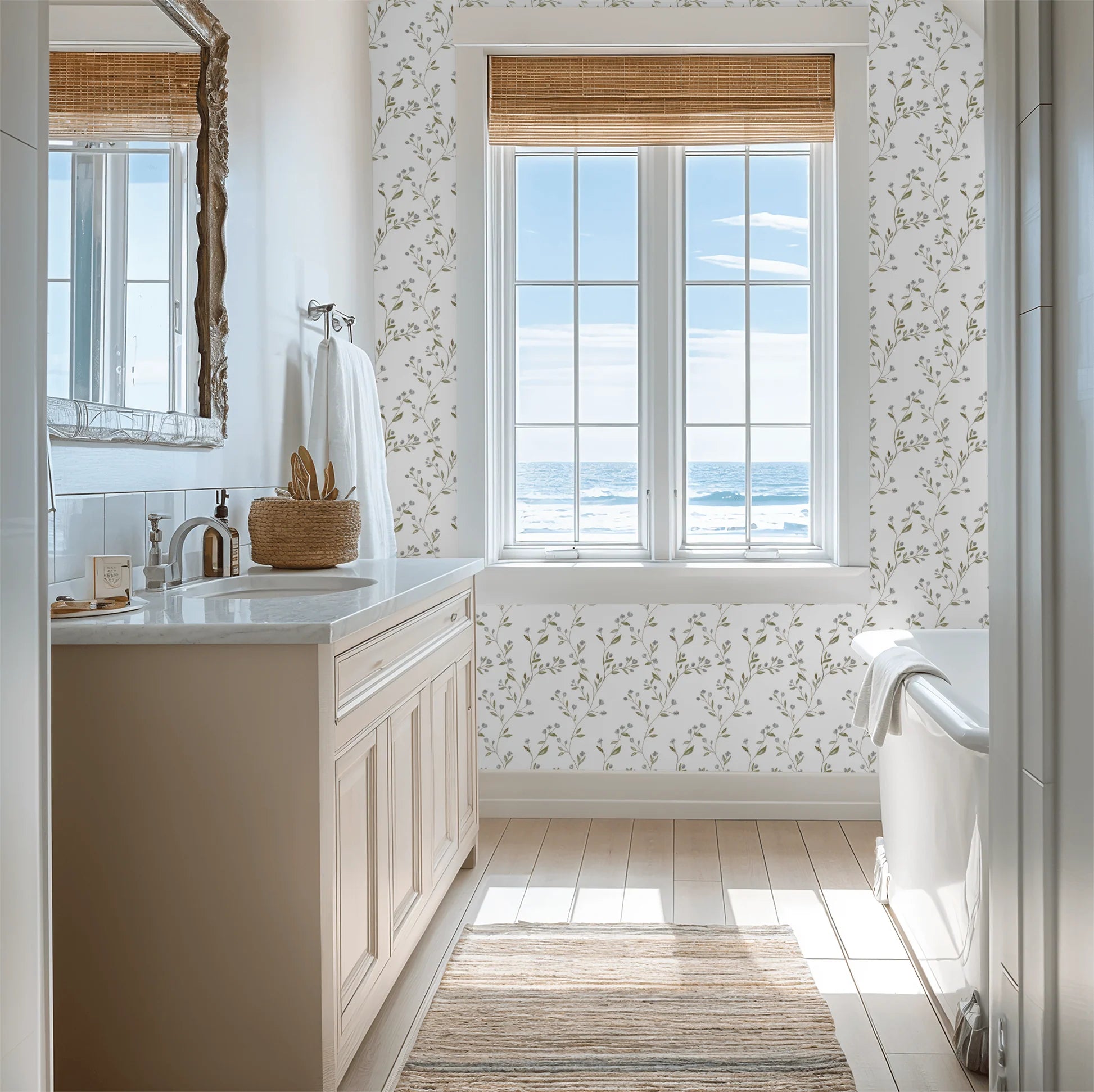Bathroom with a large window overlooking the ocean, featuring a sink and Tanglewood Trailing wallpaper.