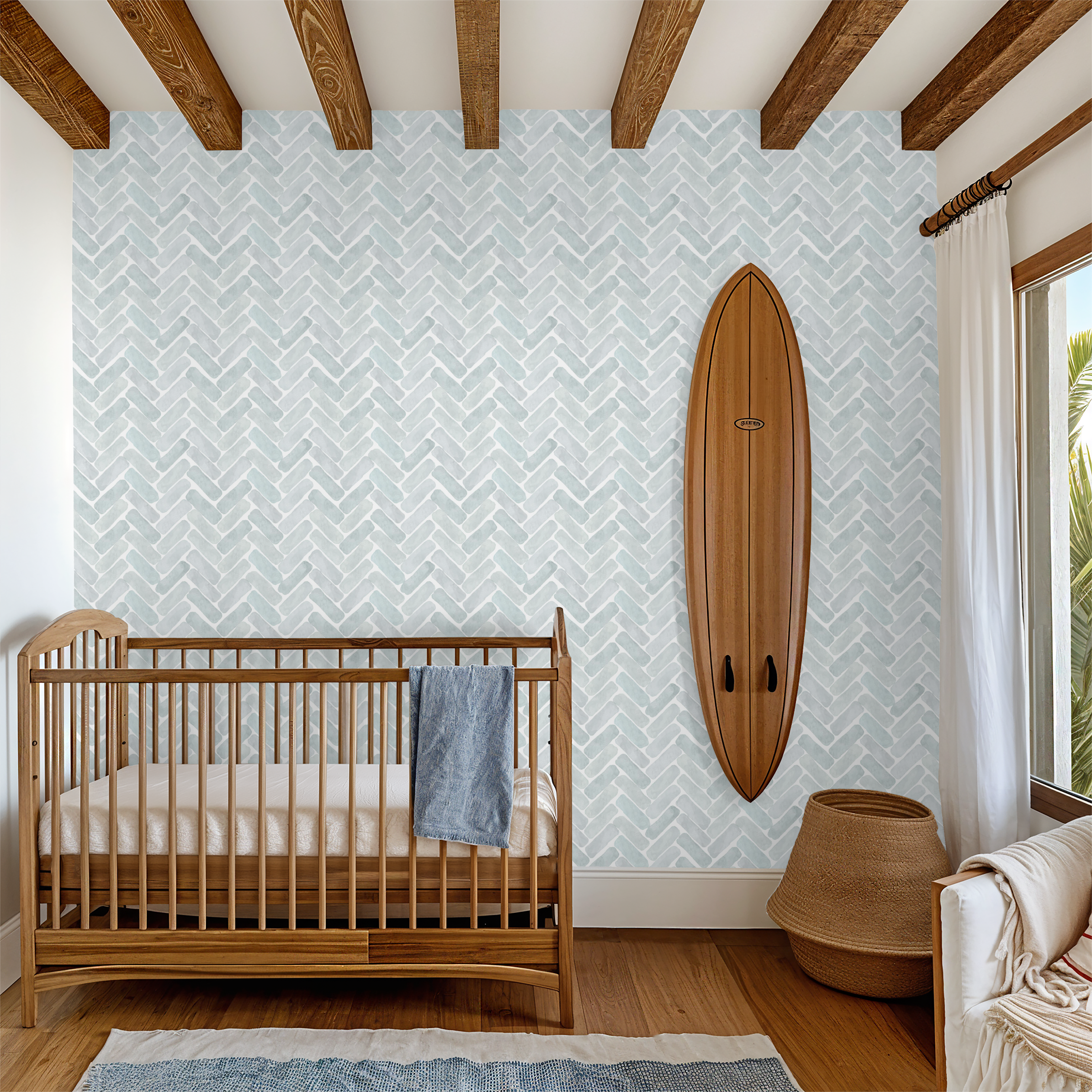 Nursery room with wooden crib, surfboard, and patterned wall.