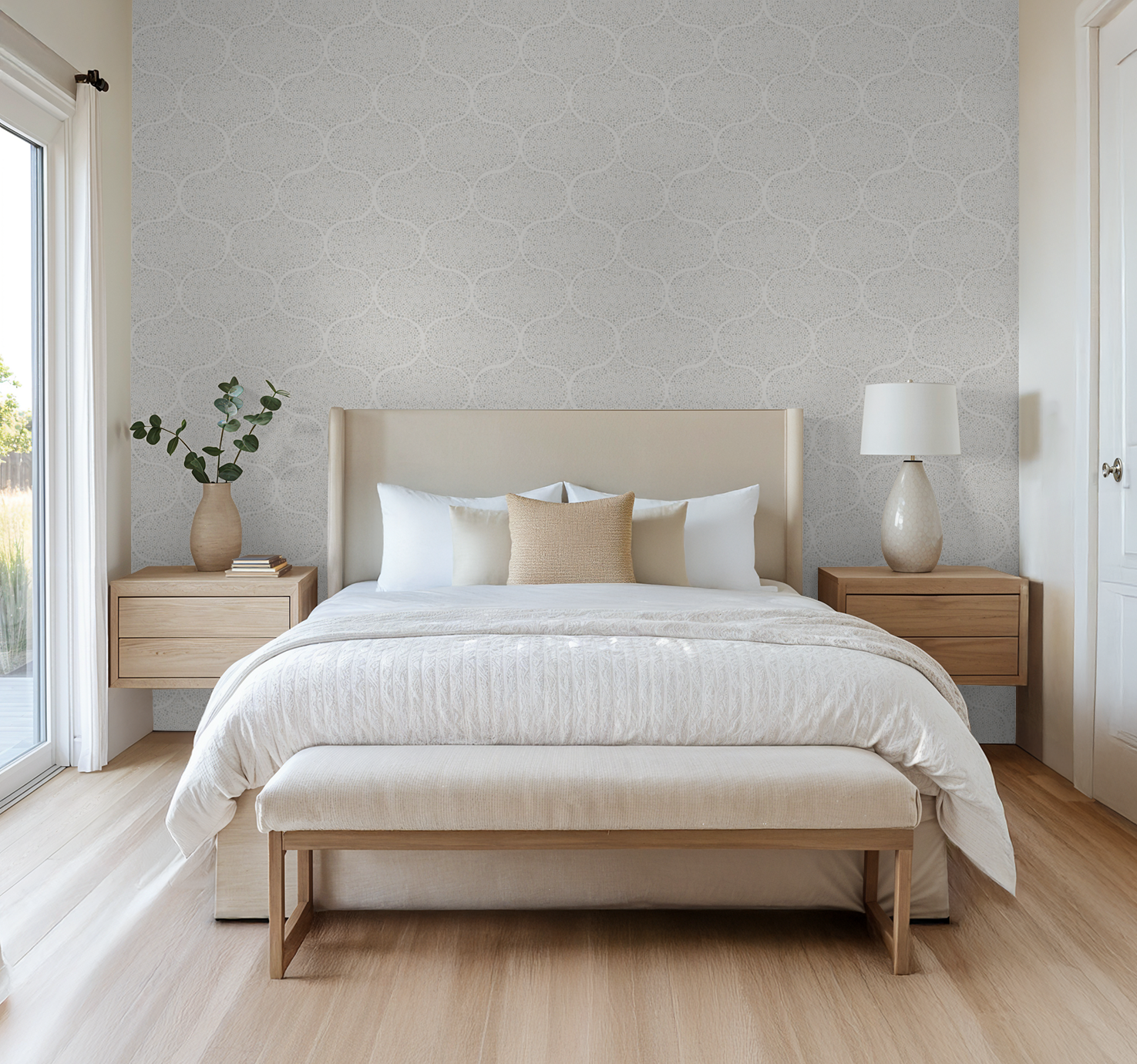 Neatly made bed with white bedding and beige pillows in a bedroom setting with a grey dotted ogee wallpaper