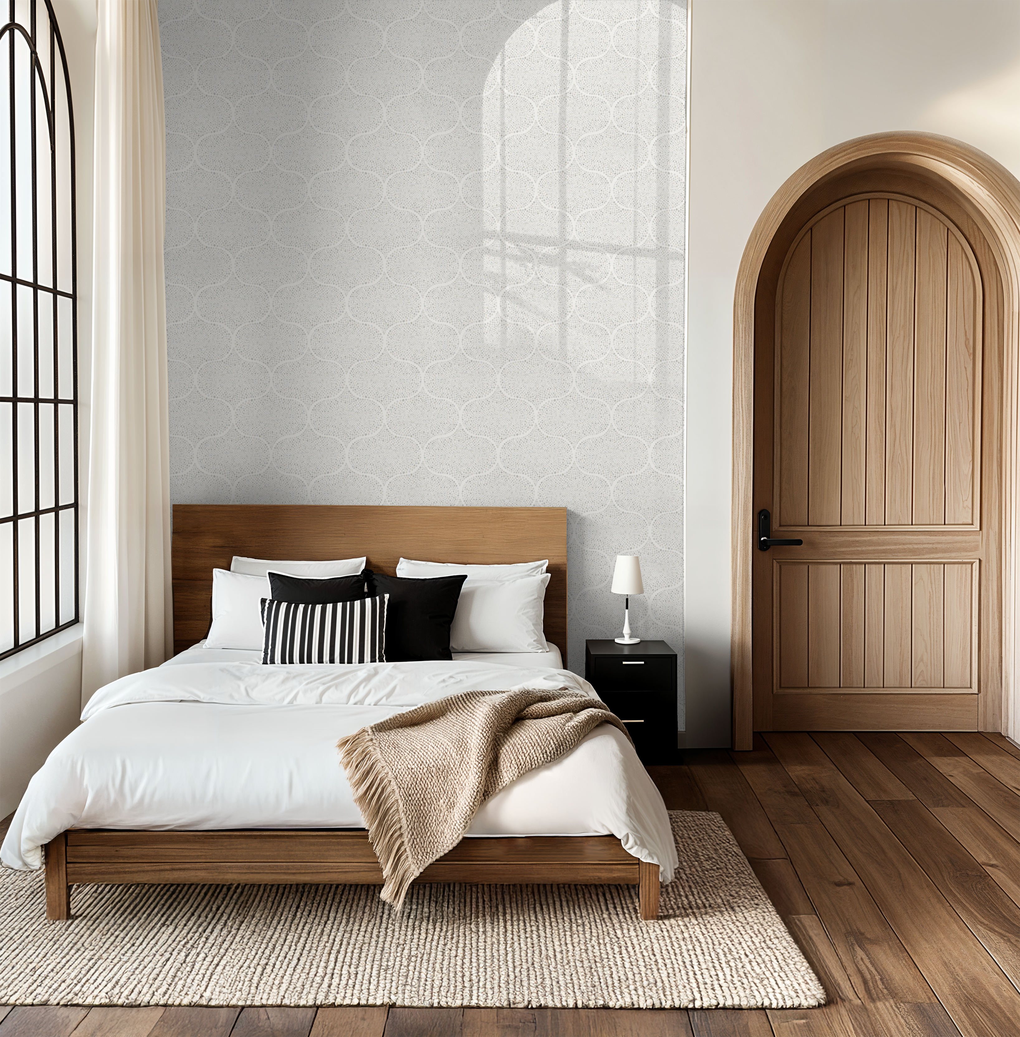 Bright bedroom showcasing the Modern Ogee Watercolor Dot Wallpaper in soft neutral tones and an airy ogee pattern.