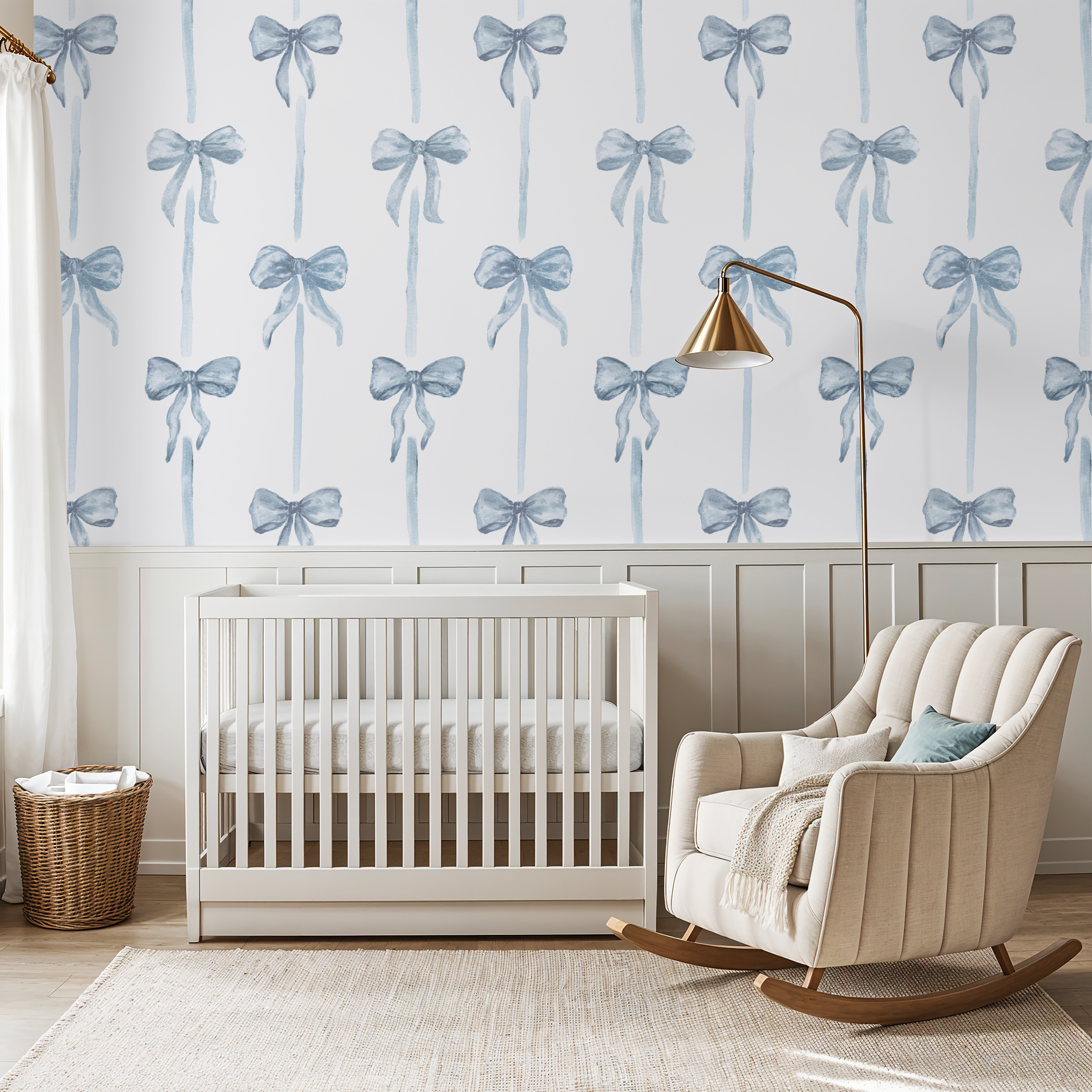 Nursery room with crib, rocking chair, and decorative wallpaper with blue bows.