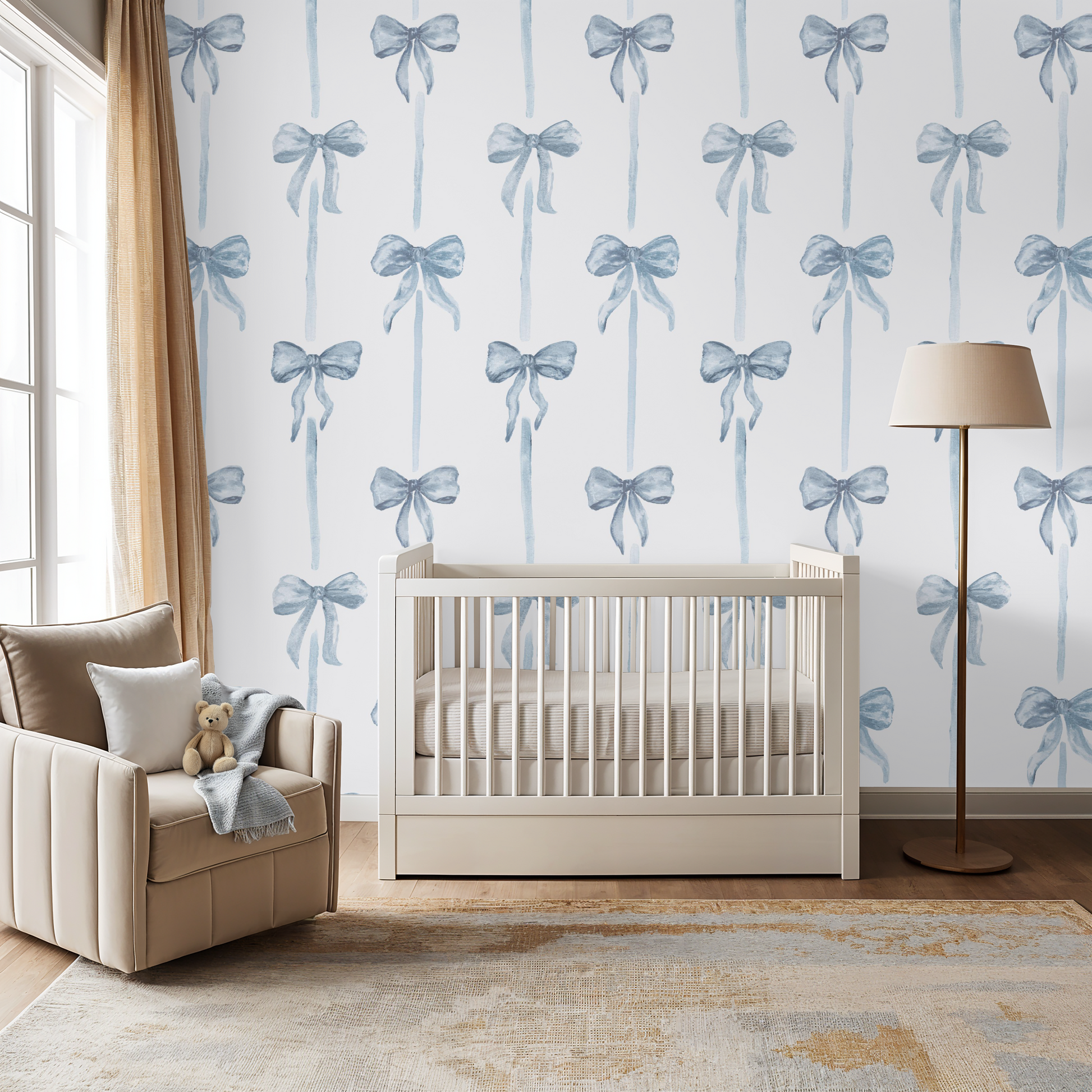 Nursery room with crib, chair, and decorative wallpaper featuring blue bows.