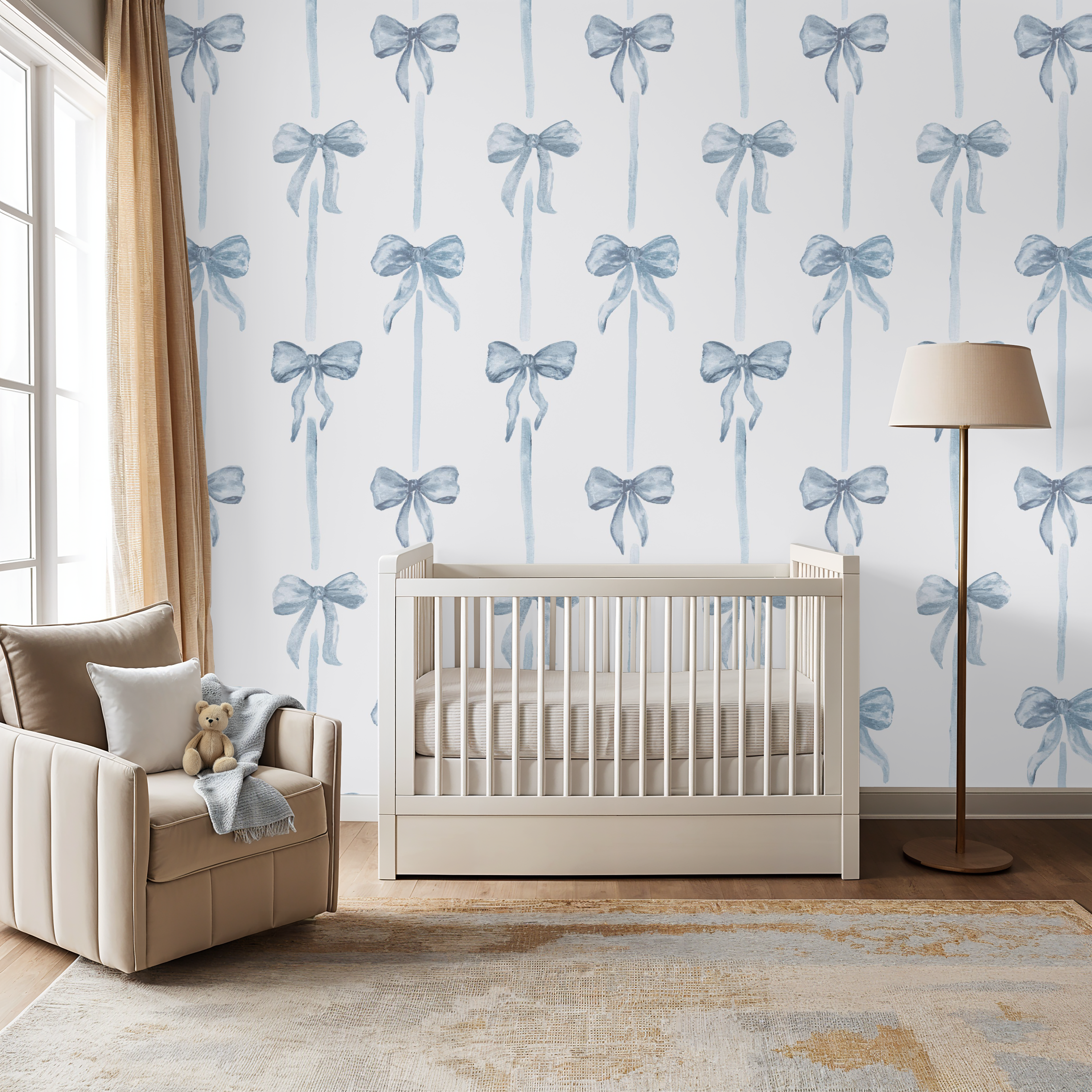 Nursery room with crib, chair, and decorative wallpaper featuring blue bows.
