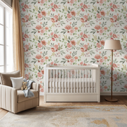 Nursery room with floral wallpaper, crib, and armchair.