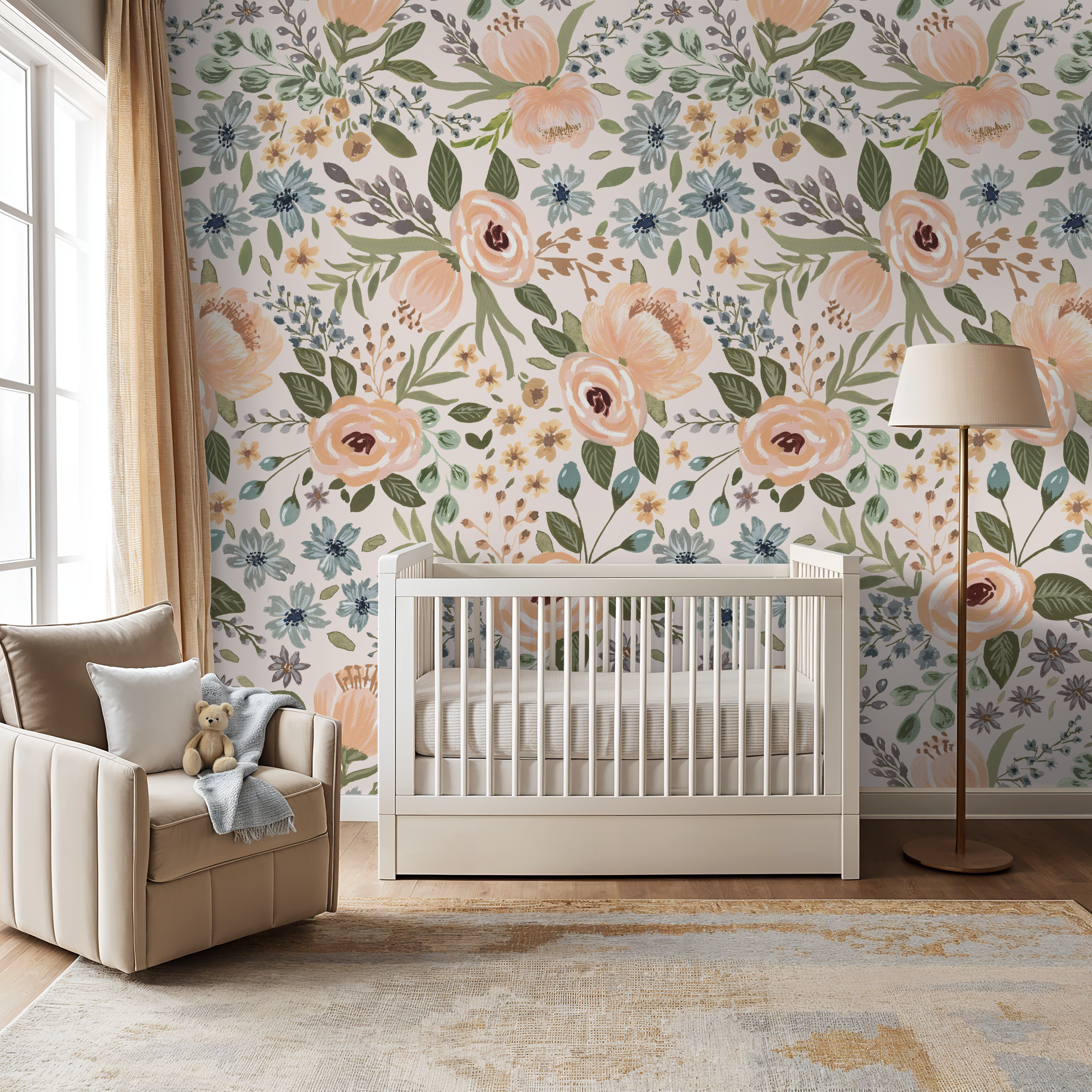 Bright nursery featuring a white crib and floor lamp set against Juliette’s Summer Blooms wallpaper, showcasing bold peach, coral, and blue florals on a blush background.