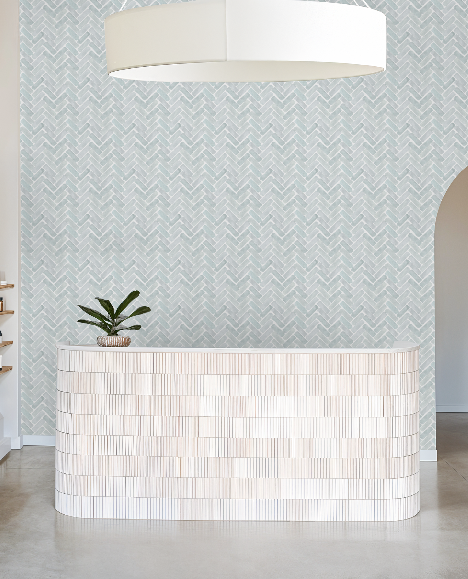 Modern interior with a patterned wall and a white tiled counter.