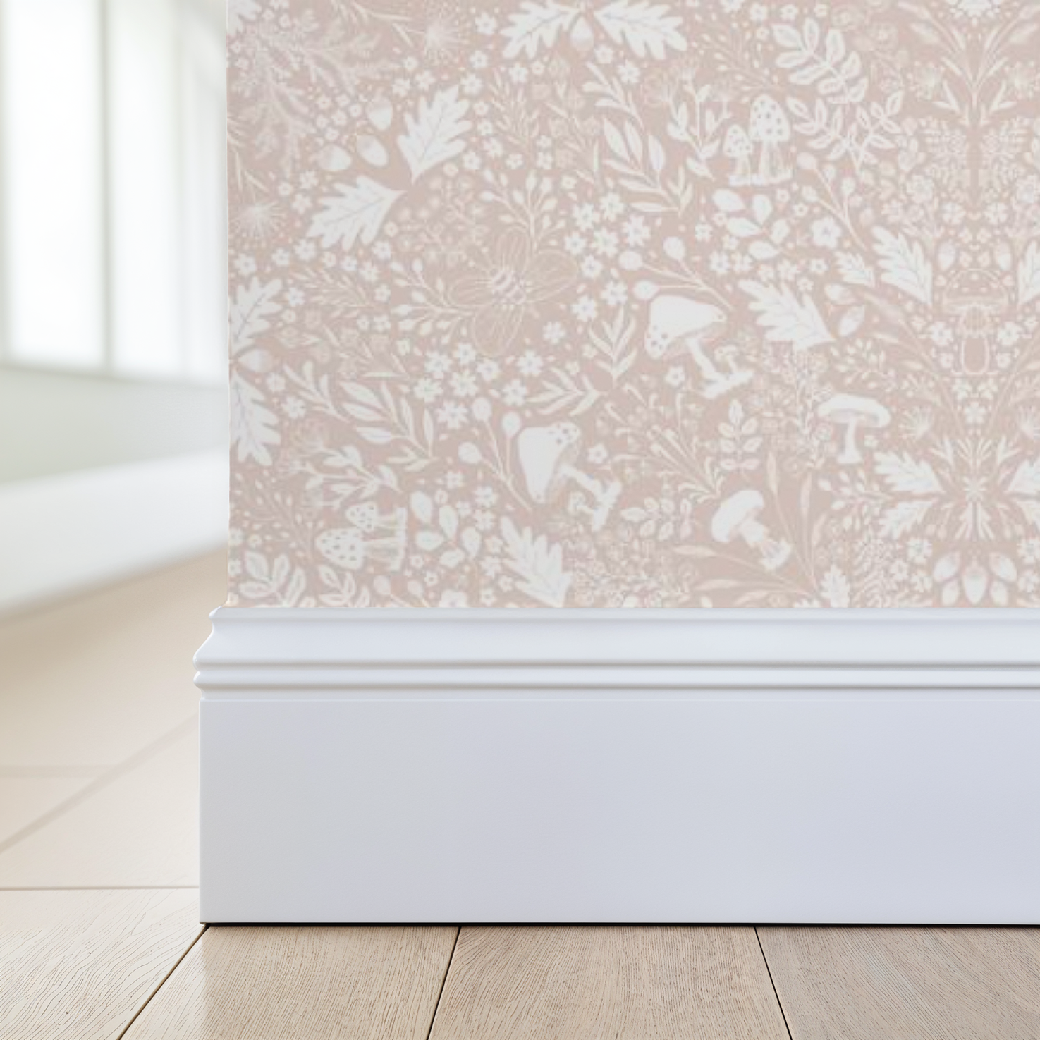 Wallpaper with a subtle floral pattern featuring mushrooms, acorns and foliage in blush pink, applied to a wall corner.