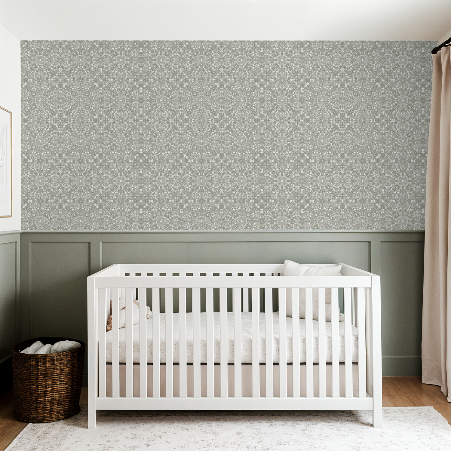 White crib in a room with patterned wallpaper and a basket.
