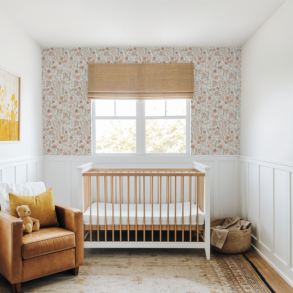 Nursery room with wooden crib, brown armchair, and floral wallpaper.