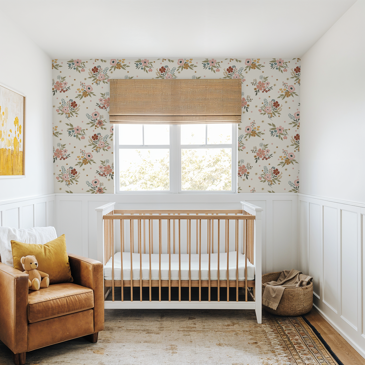 Nursery room with wooden crib, brown armchair, and floral wallpaper.