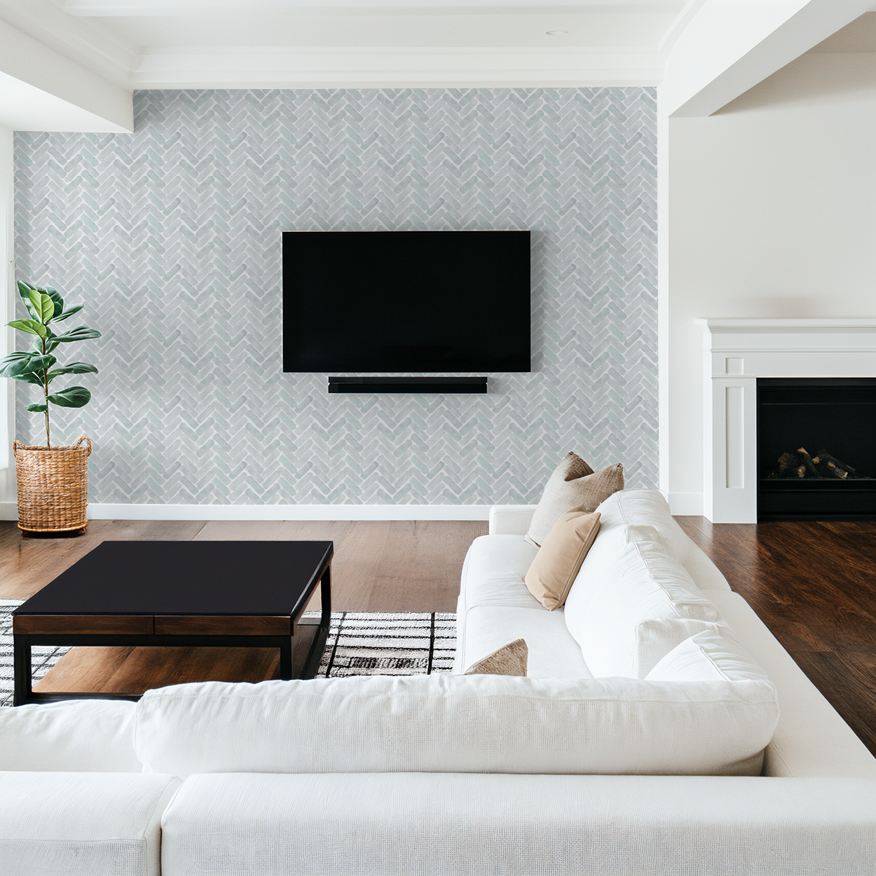 Modern living room with white sofa, black coffee table, and wall-mounted TV.