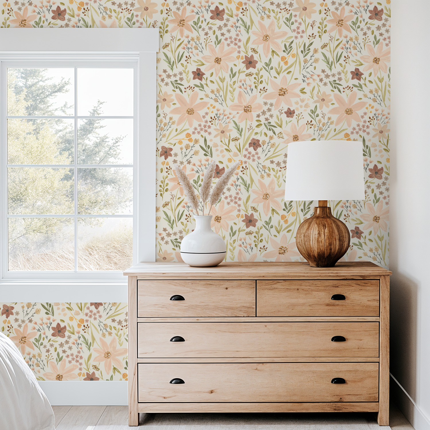 Wooden dresser with decorative items against a floral wallpapered wall.