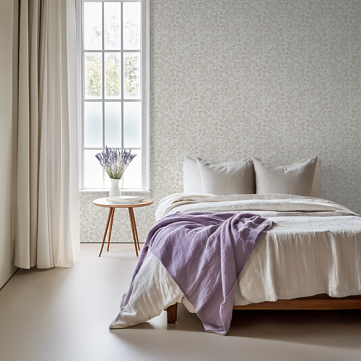 Bedroom with a bed featuring a purple blanket, white pillows, and a side table with a vase of flowers.