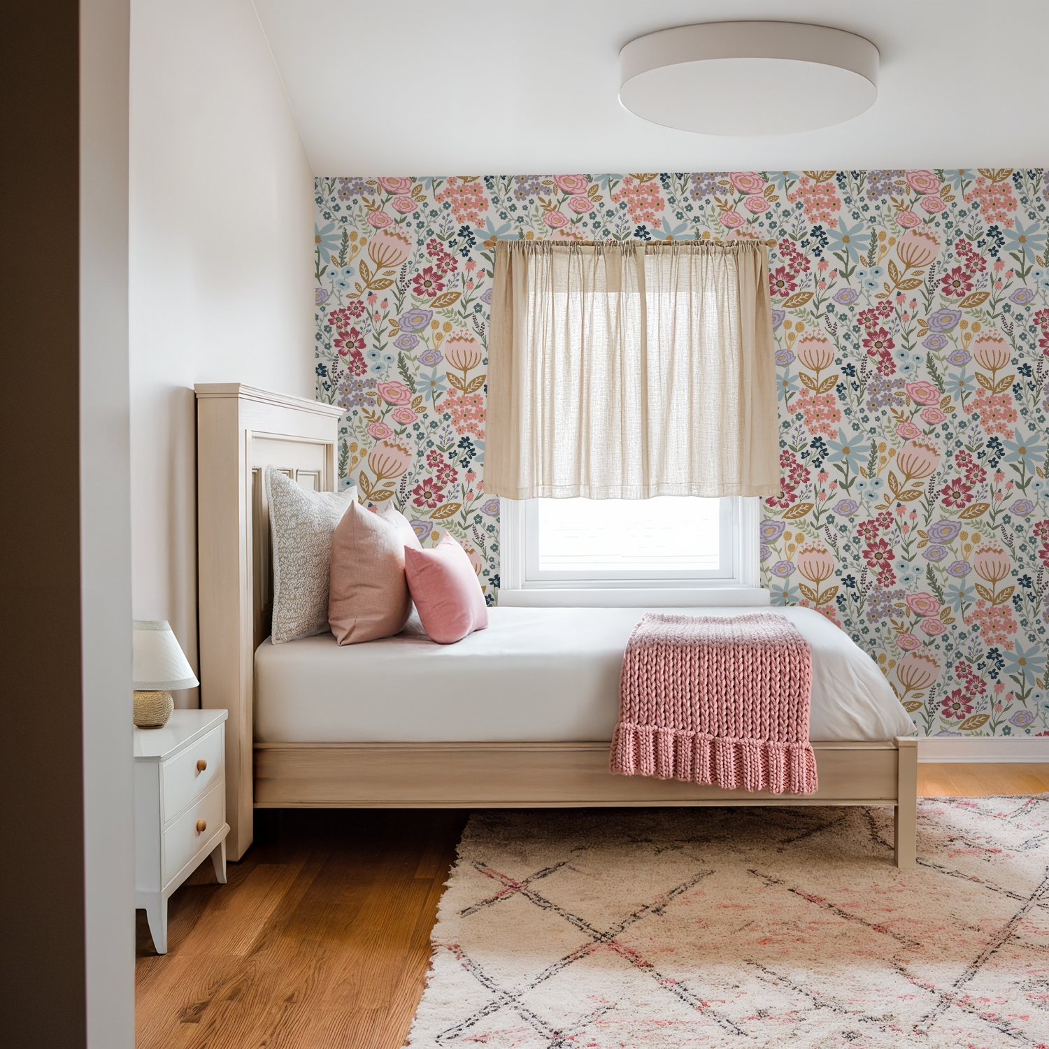 Bedroom with floral wallpaper, wooden bed, and pink accents