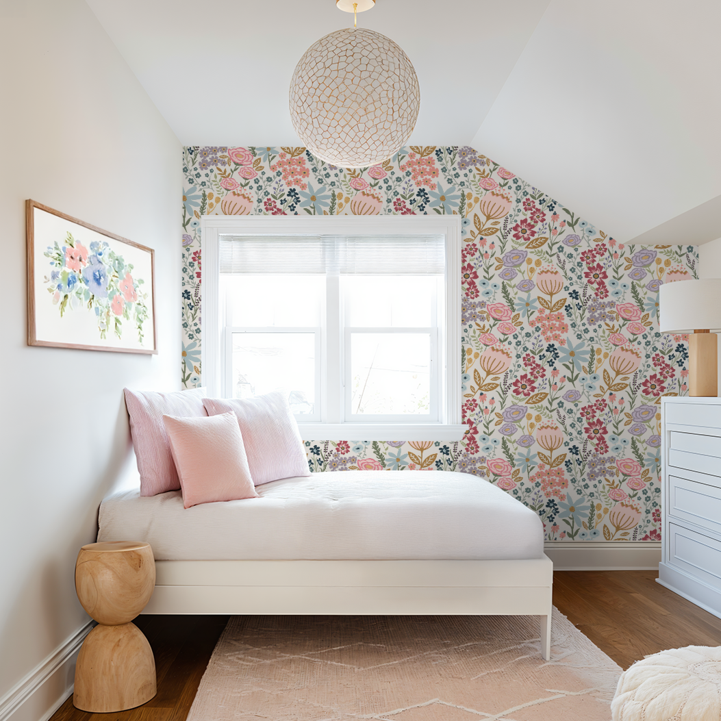 Bedroom with floral wallpaper, white bed, and wooden stool.