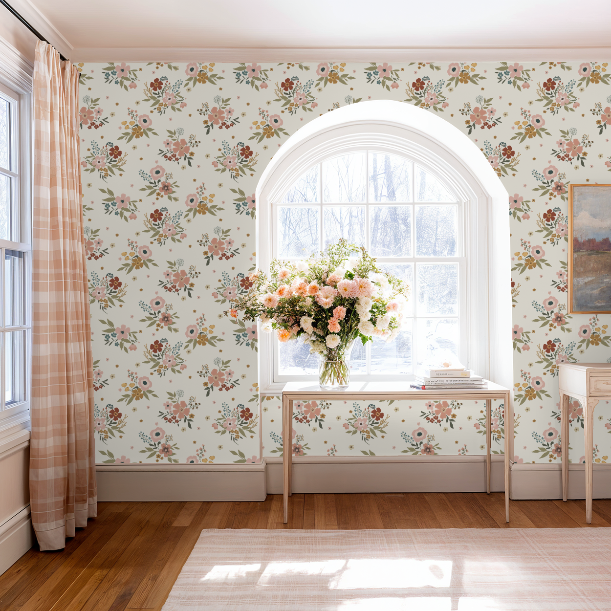 Room with floral wallpaper, a table with flowers, and a window.
