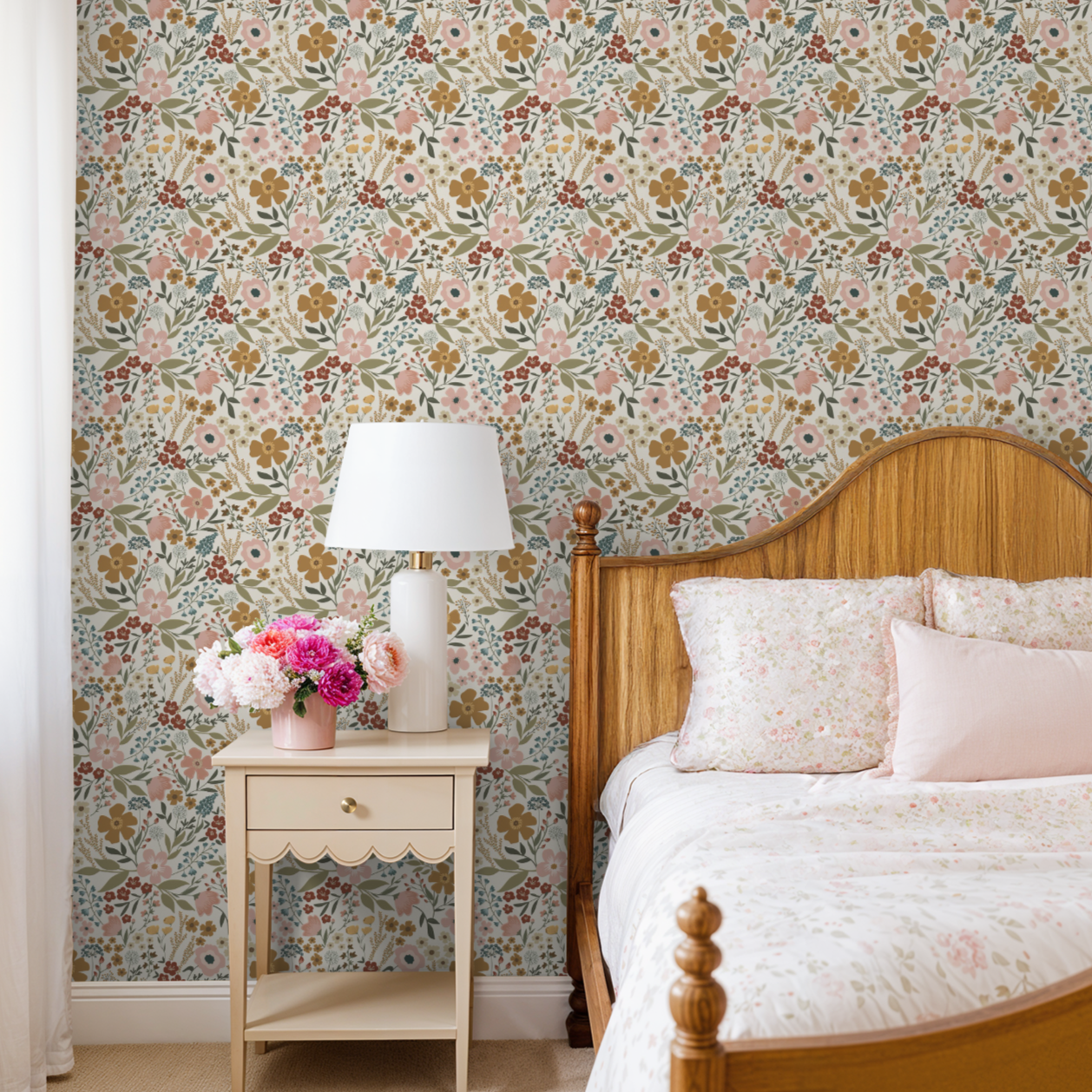 Bedroom with floral wallpaper, wooden bed, and nightstand with lamp and flowers.