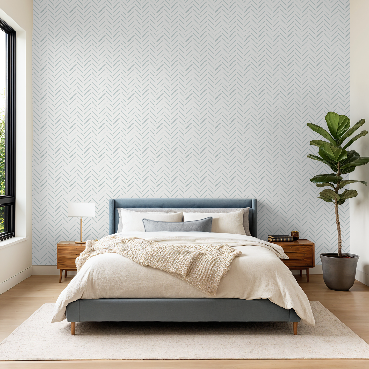 Blue skinny herringbone wallpaper behind a modern bedroom setup with a blue upholstered bed and neutral linens.