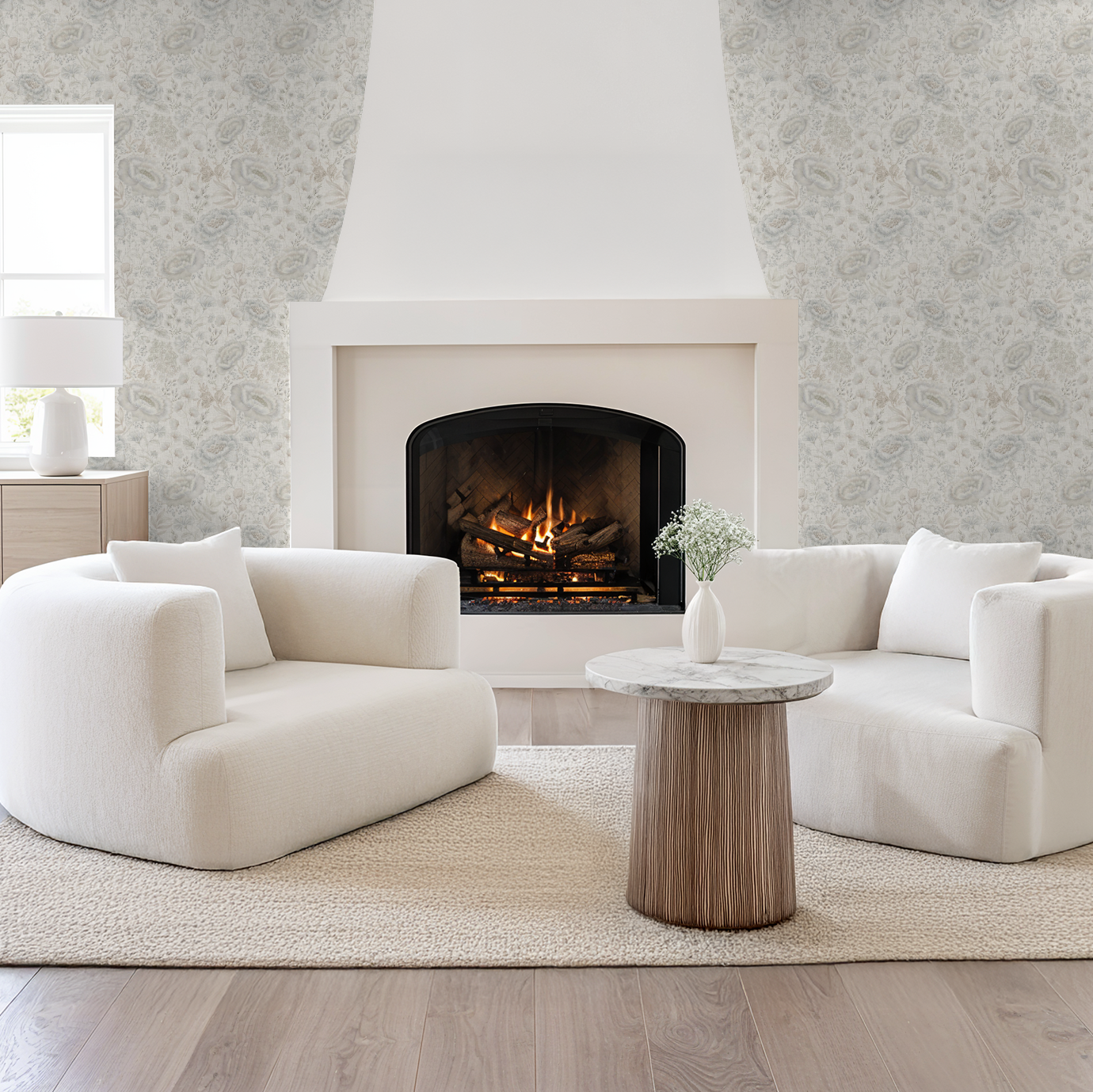 Modern living room with white sofa, wooden coffee table, and fireplace.