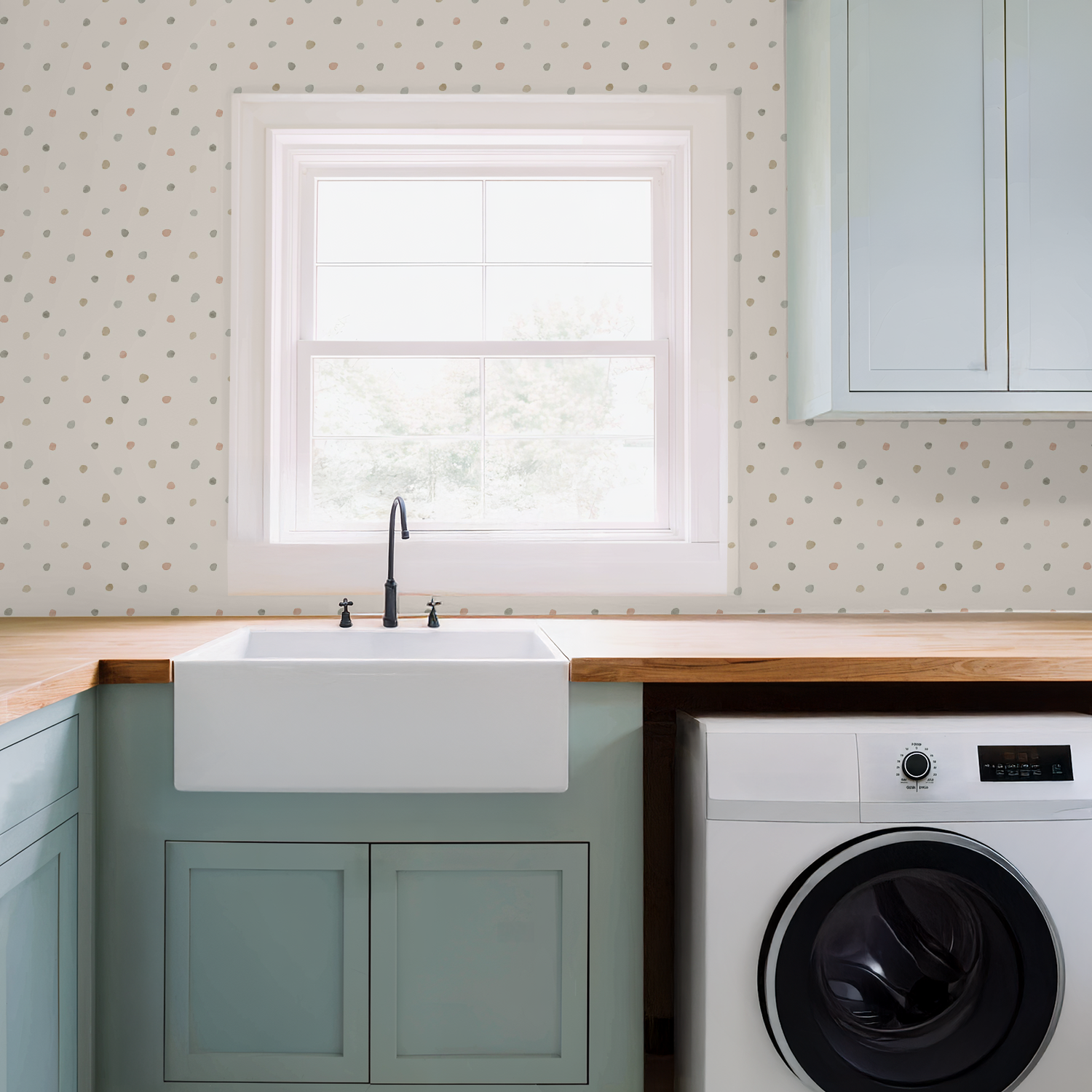 Modern laundry room with white sink, wooden countertop, and washing machine.