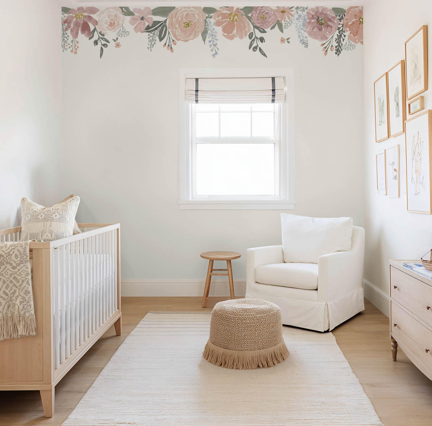 Nursery room with crib, armchair, and decorative wall mural wallpaper.
