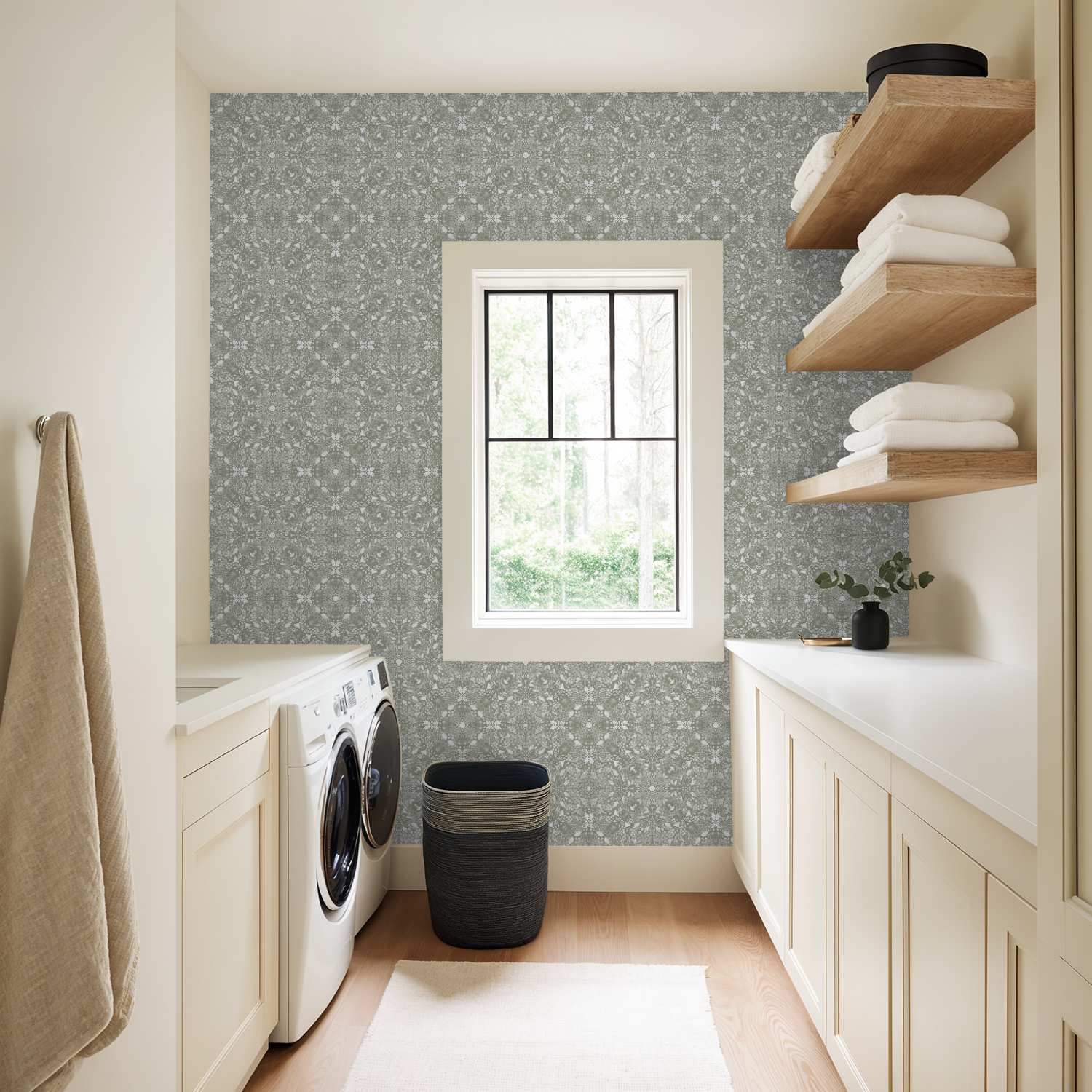 Modern laundry room with washing machine, shelves, and Woodland Lace in Sage wallpaper.