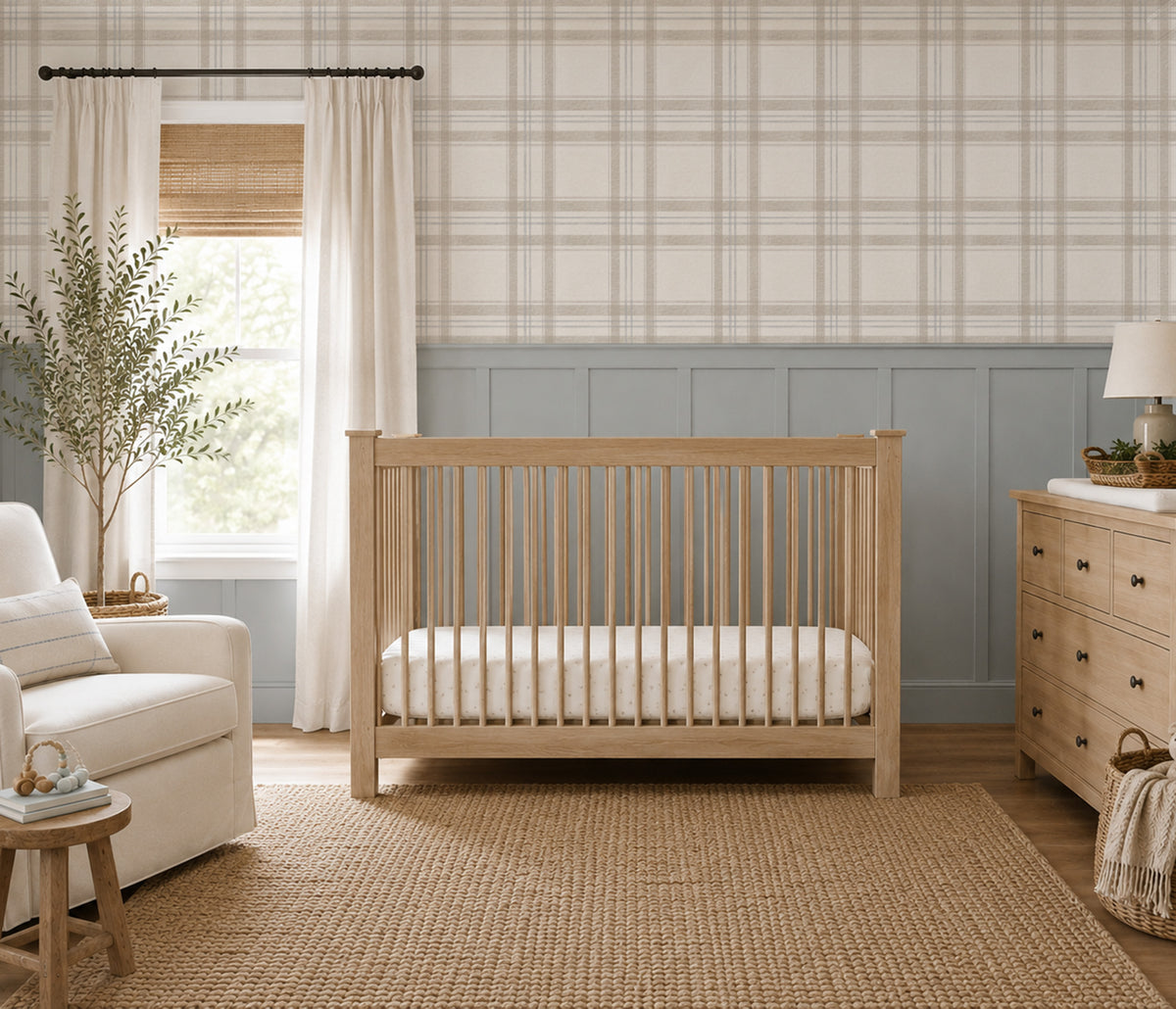 London Plaid wallpaper in soft taupe, oatmeal and faded blue in a neutral nursery with grey wainscoting and a natural wood crib