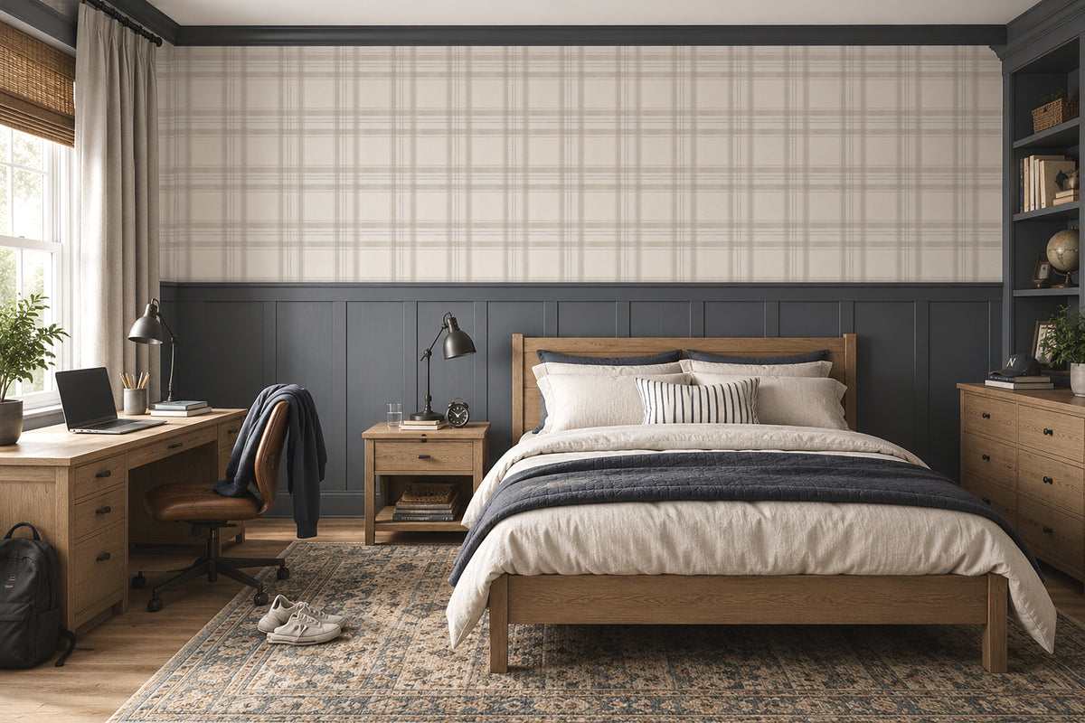 London Plaid wallpaper in a teen boys bedroom with charcoal wainscoting, warm wood furniture and layered neutral bedding