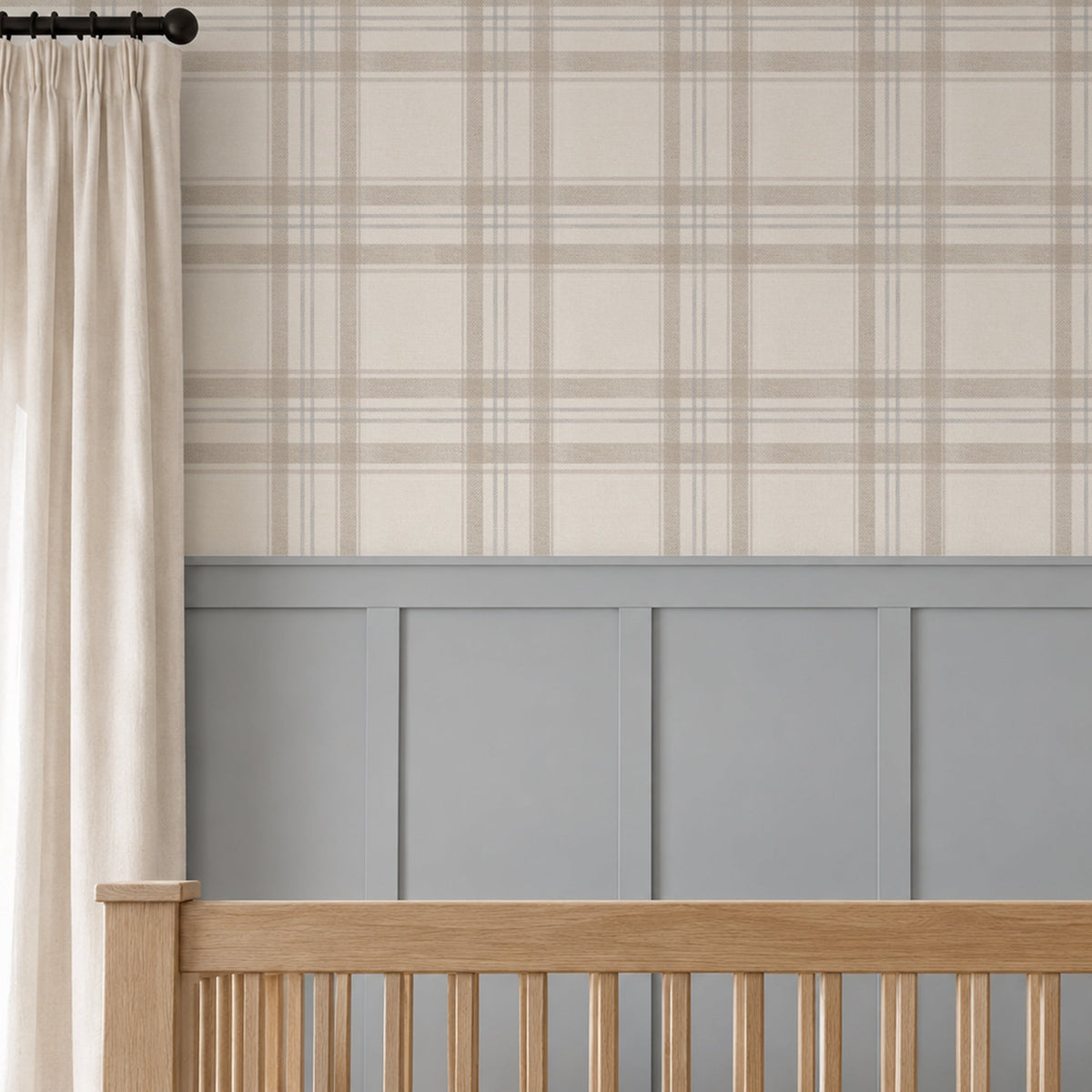 London Plaid wallpaper in soft taupe, oatmeal and faded blue above grey wainscoting in a neutral nursery with a natural wood crib