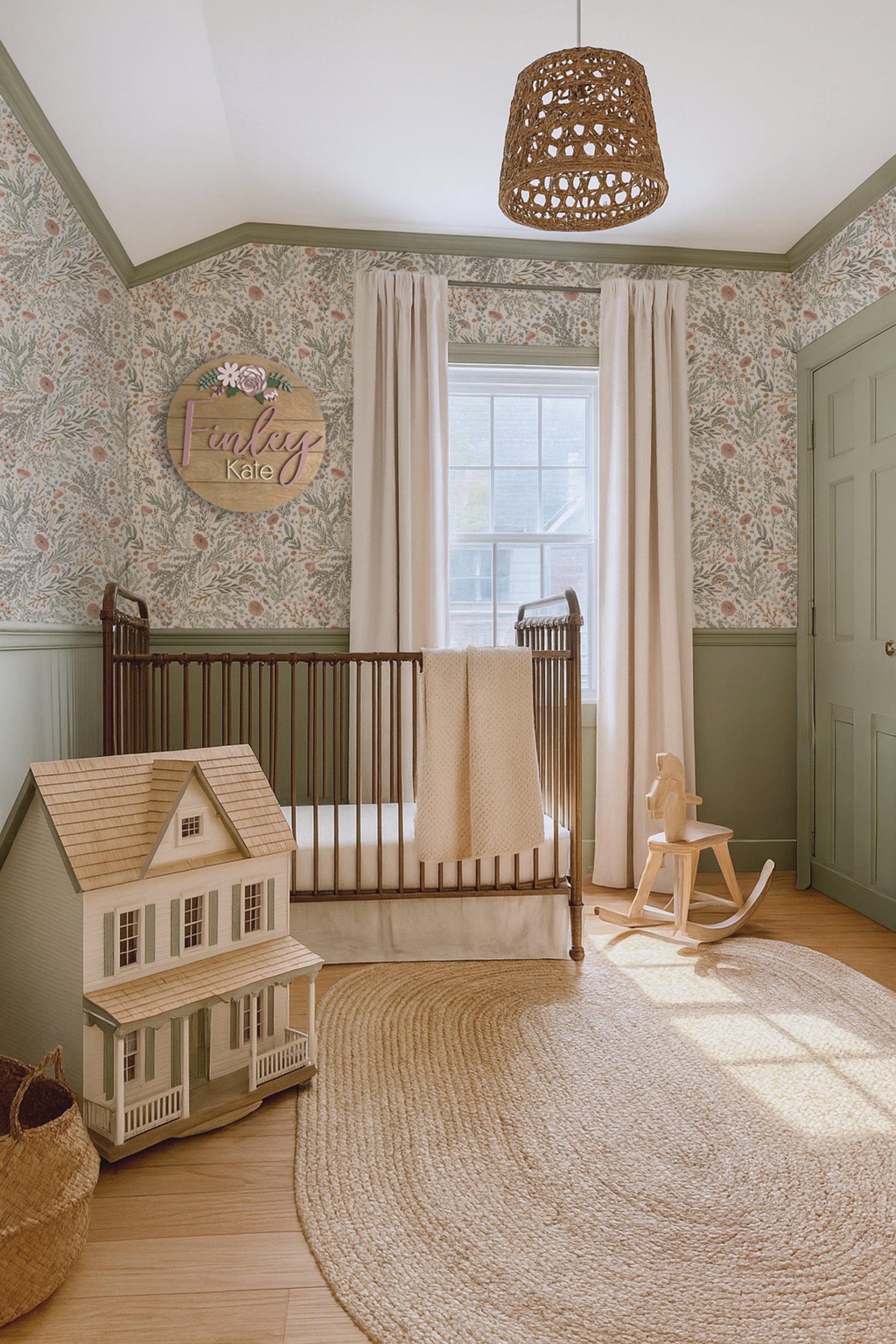 and vintage nursery in sage green with floral wallpaper and a doll house