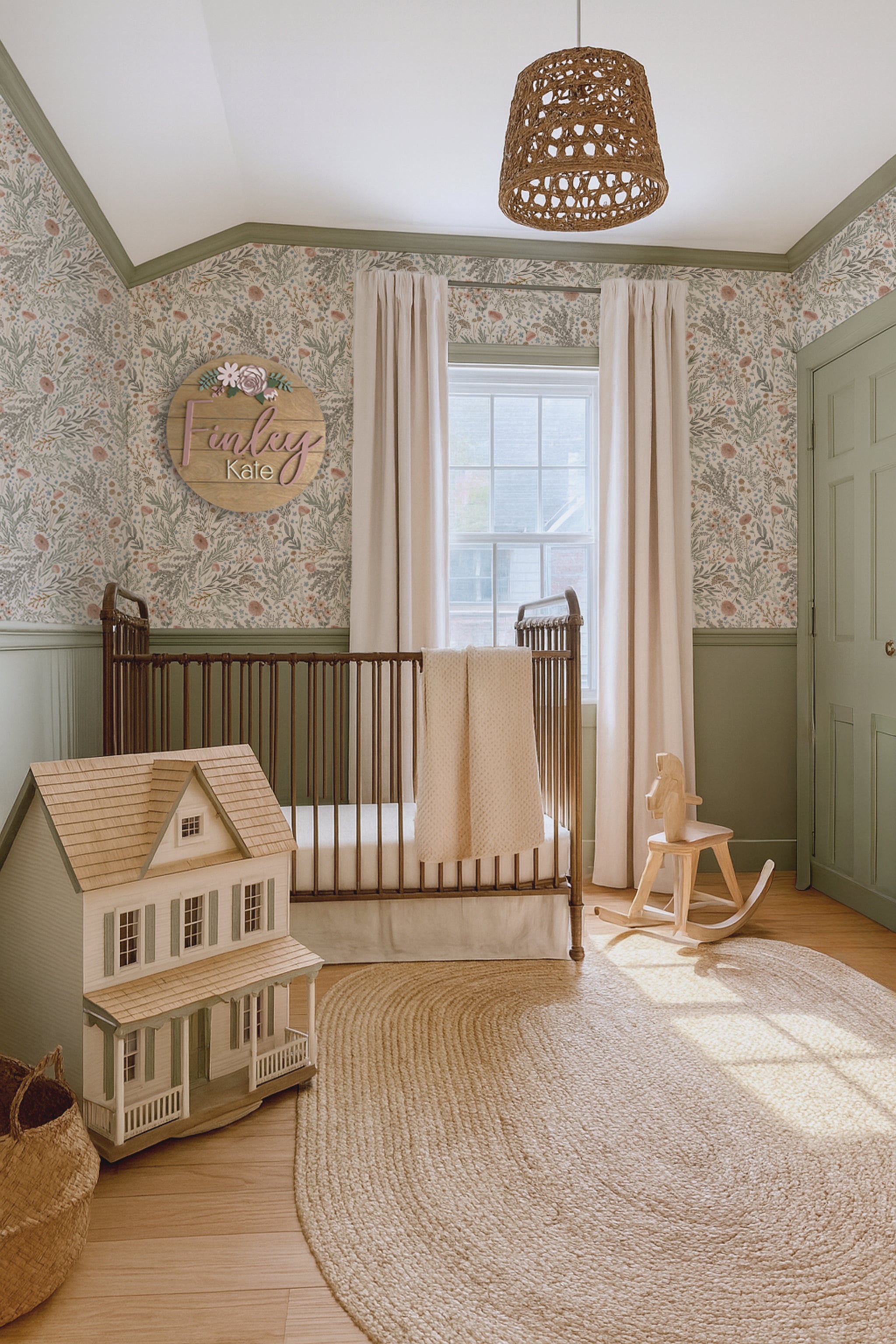 and vintage nursery in sage green with floral wallpaper and a doll house