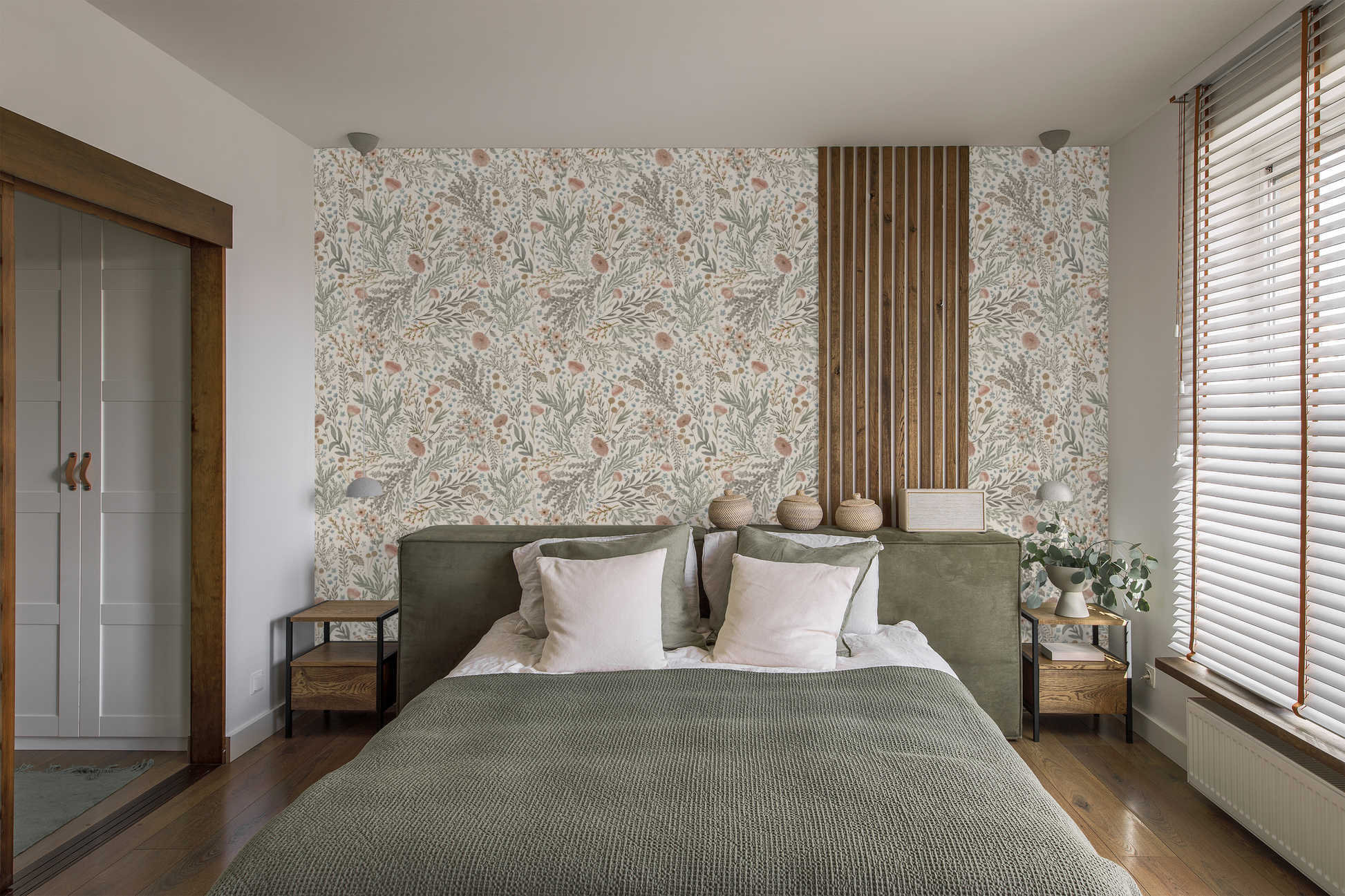 Modern bedroom with floral wallpaper, green bedspread, and wooden furniture.