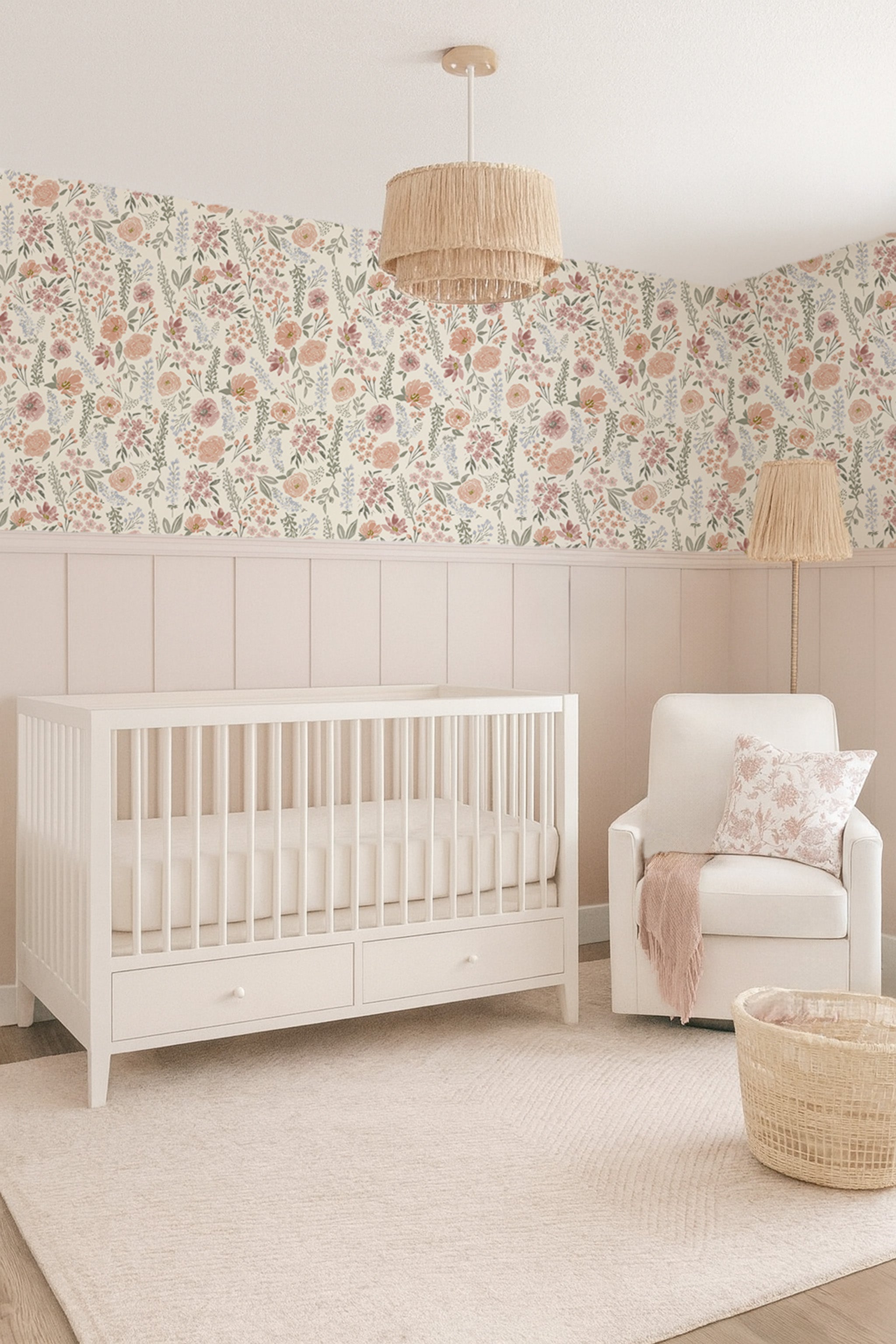 Blush vintage floral wallpaper mural featuring peonies and roses in a nursery with wood crib and muted pink and sage tones blush board and batten.