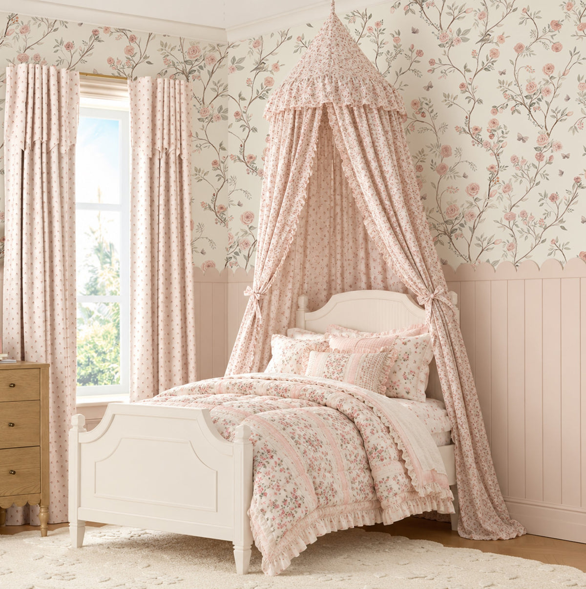 Aurora trailing pink rose wallpaper above scalloped wainscoting in a girl's bedroom with floral canopy bed.