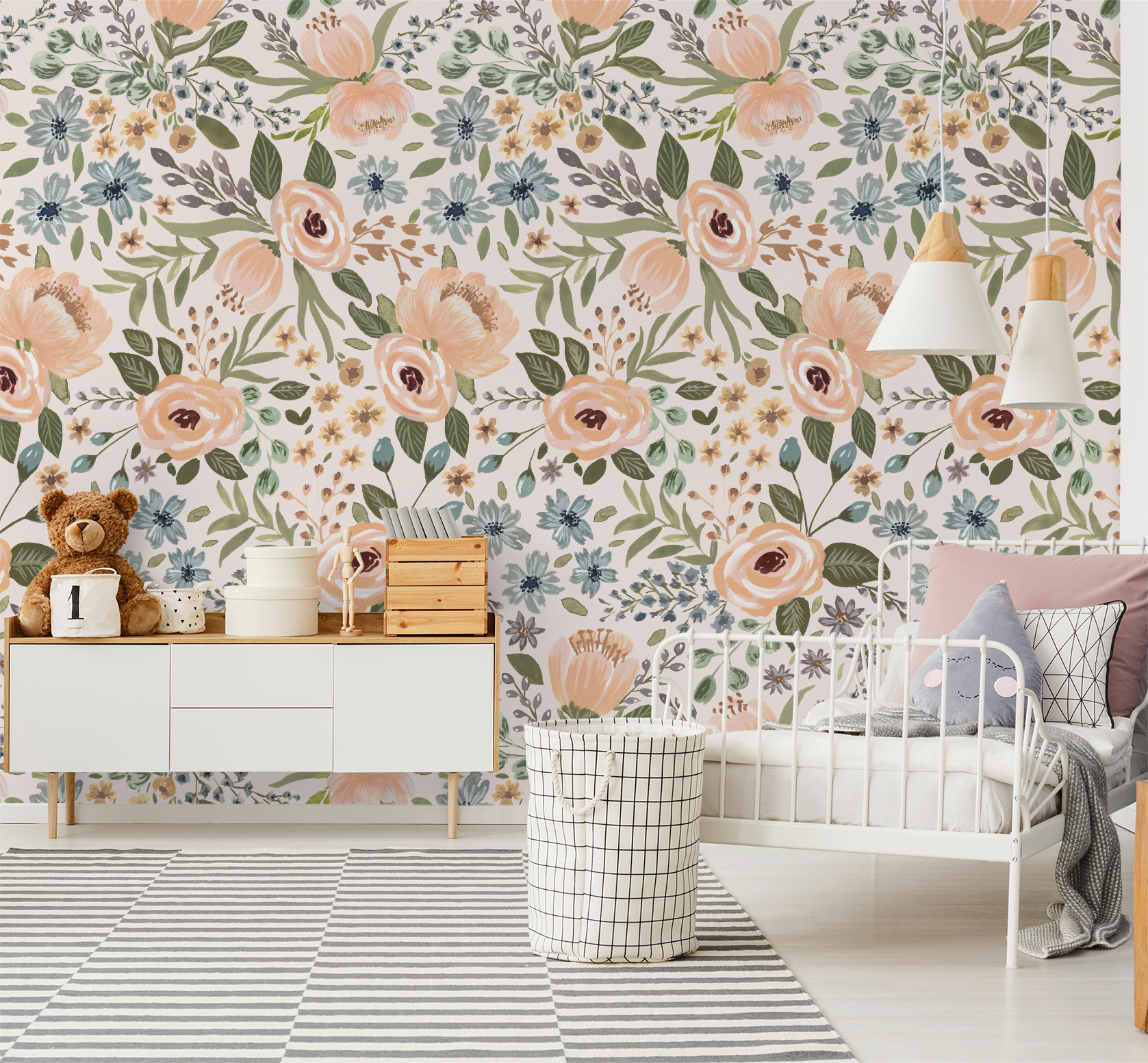 Floral wallpaper with peaches, greens, blues in a cozy nursery setting.
