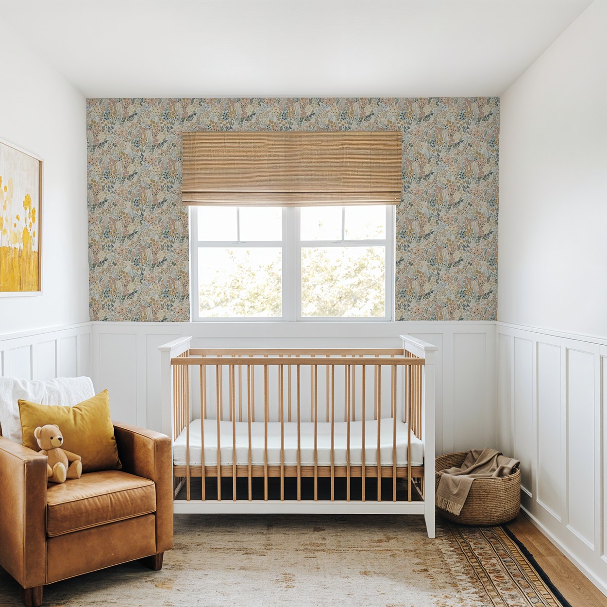 Heirloom floral wallpaper in cozy nursery with leather chair and wood crib