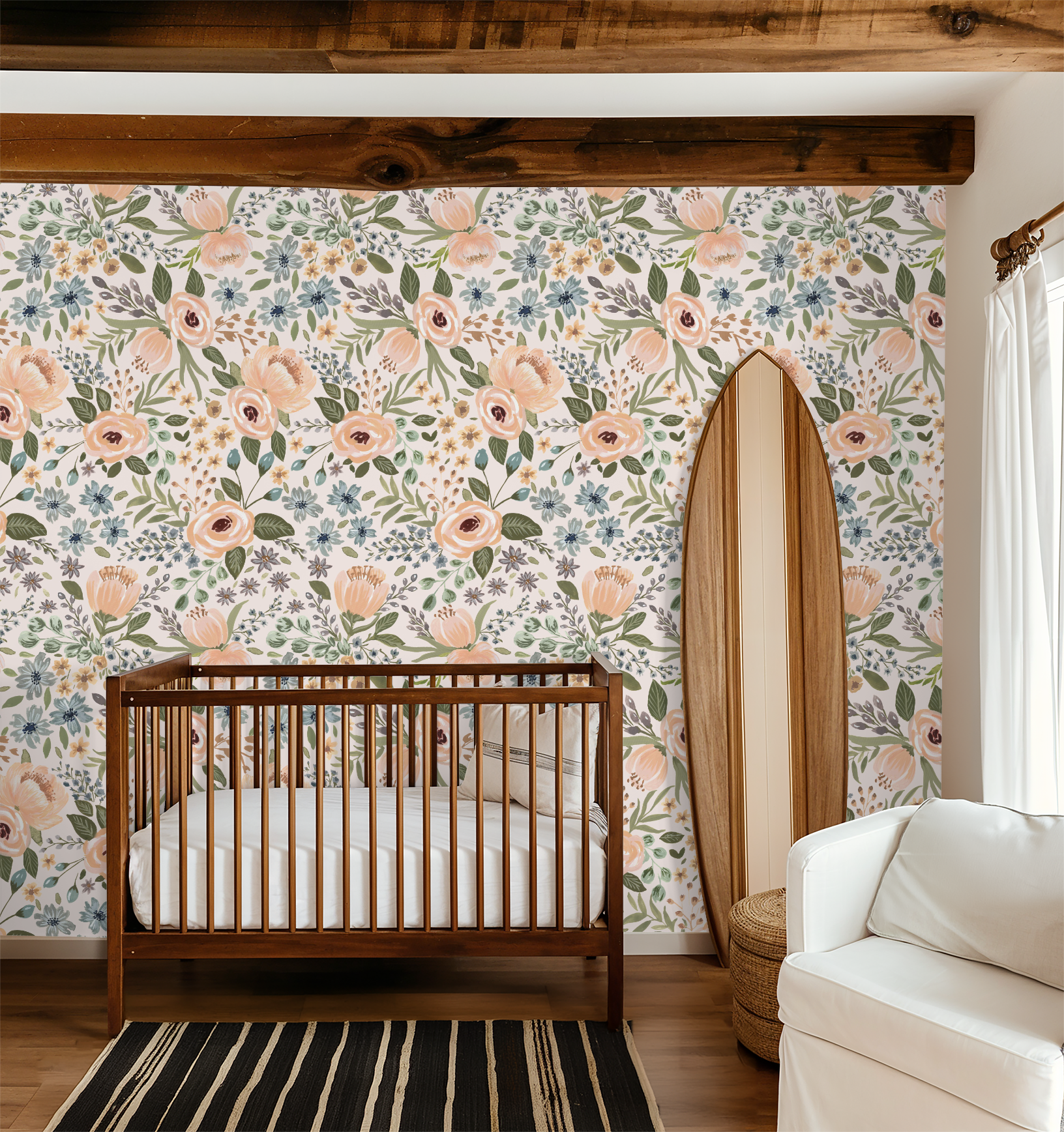 Nursery with floral wallpaper featuring peaches, greens, blues in a cozy setting.
