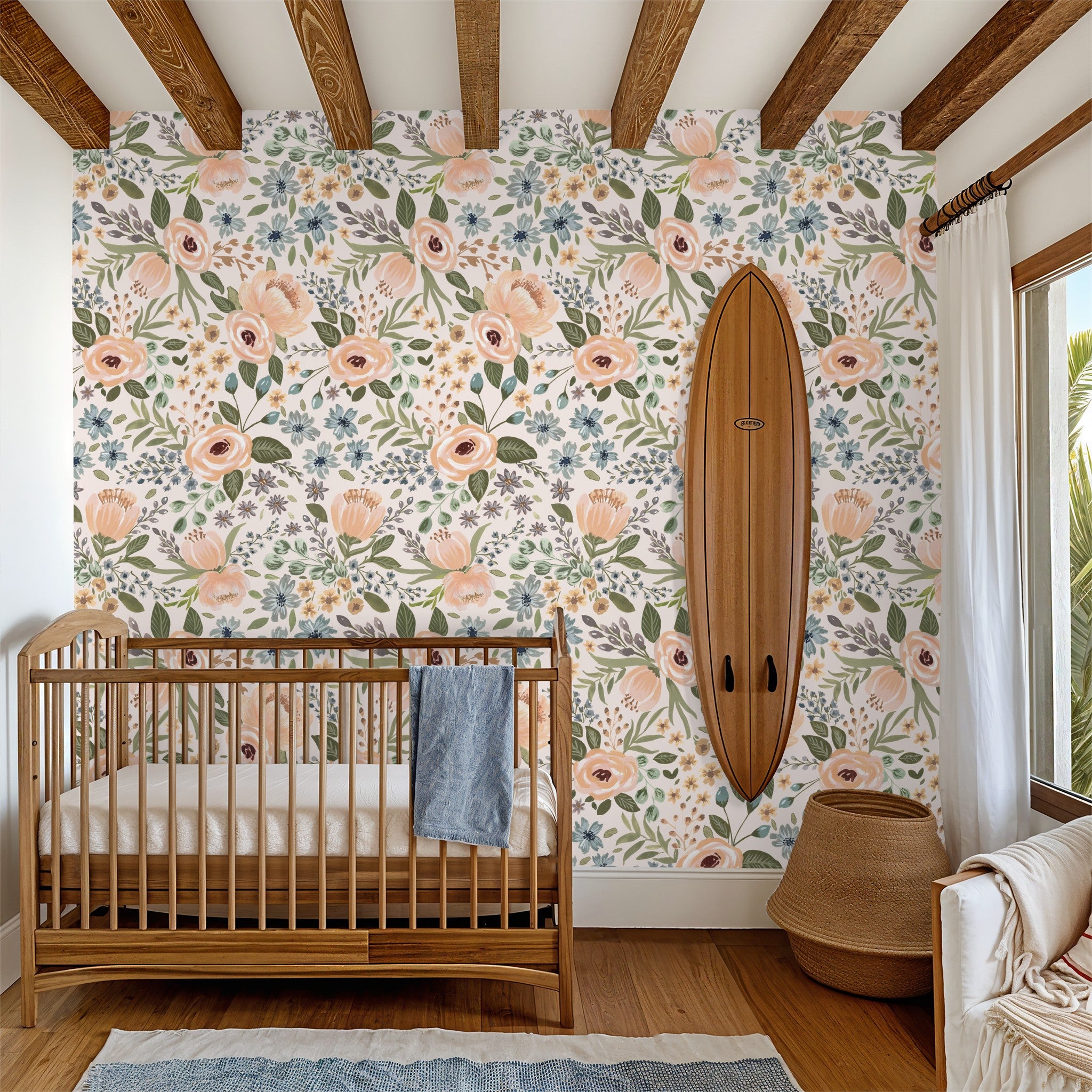 Nursery with Juliette's Summer Blooms floral wallpaper in peaches, greens, and blues.