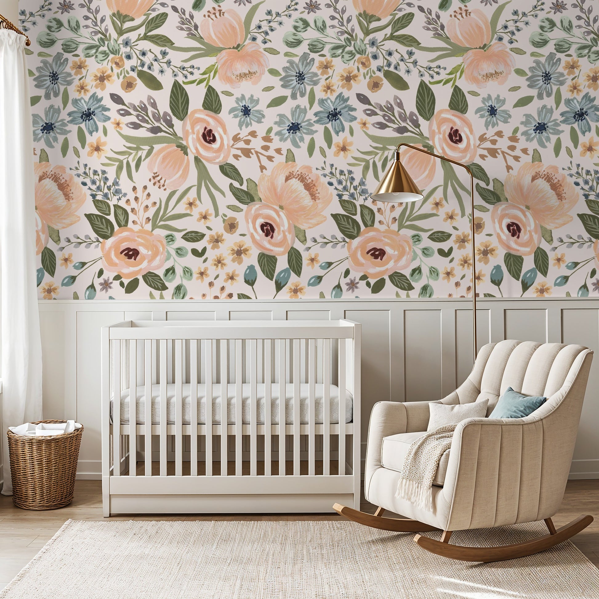 Floral wallpaper with peaches, greens, and blues in a nursery with crib and rocking chair.