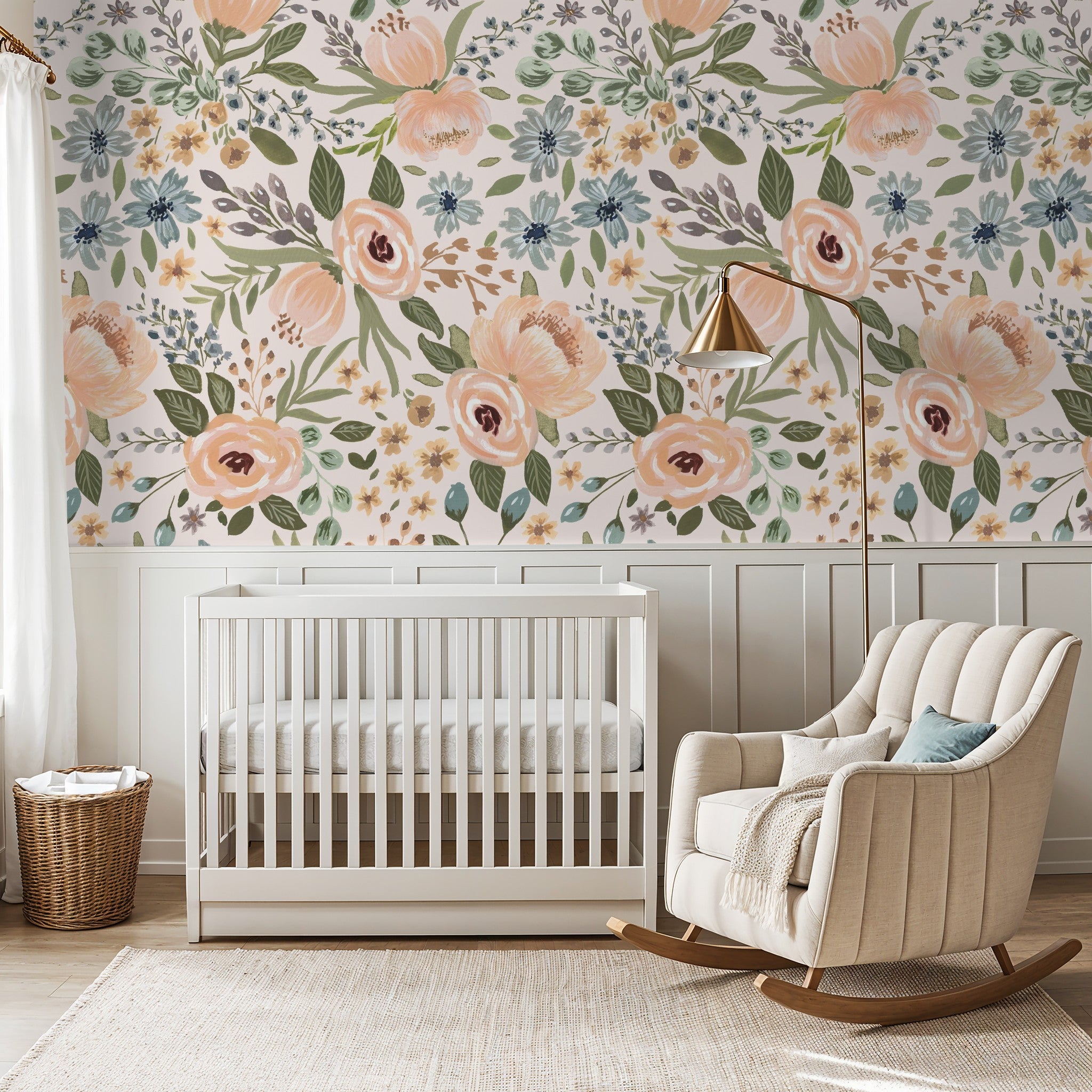 Floral wallpaper with peaches, greens, and blues in a nursery with crib and rocking chair.