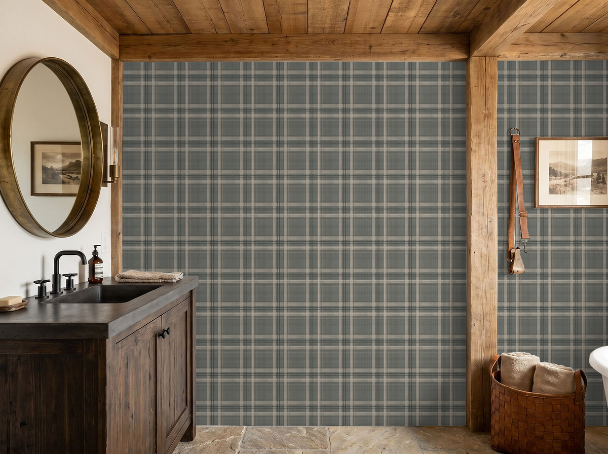 Lodge Plaid wallpaper in a boys' bedroom with vintage national park pennants, wood dresser and plaid bedding.