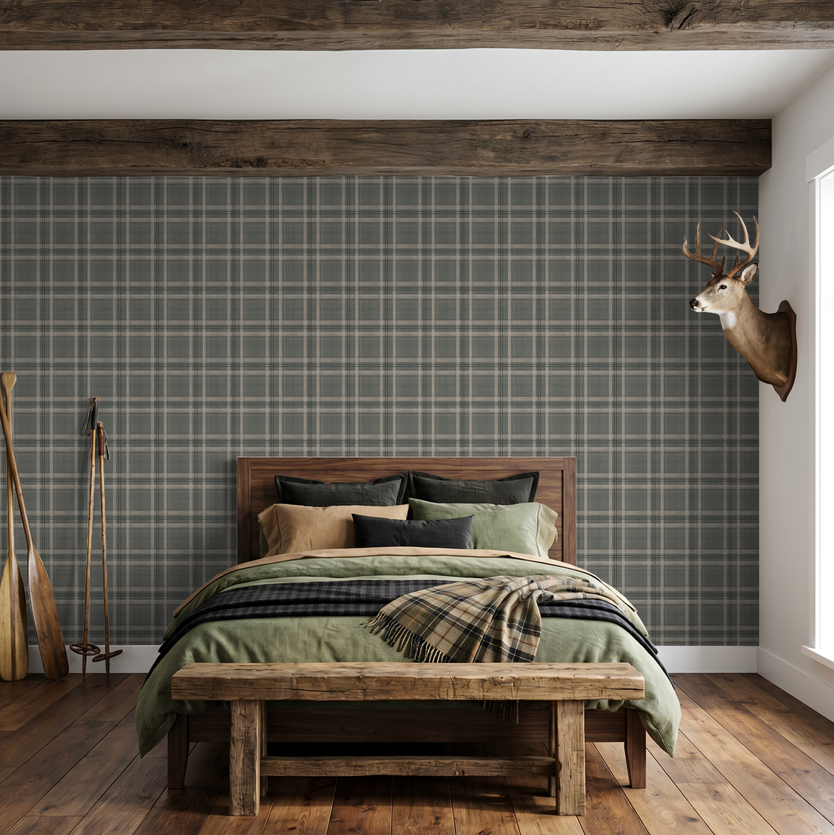 Lodge Plaid wallpaper in a rustic bedroom with exposed wood beam, wooden bed, green bedding and plaid throw.