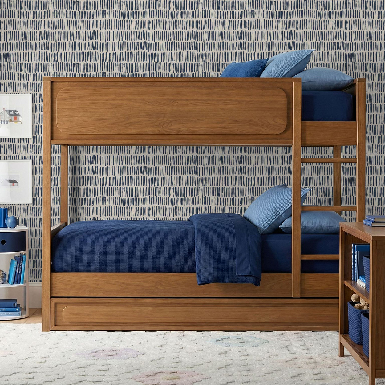 Navy abstract brushstroke wallpaper in a modern bedroom with wooden bunk bed.