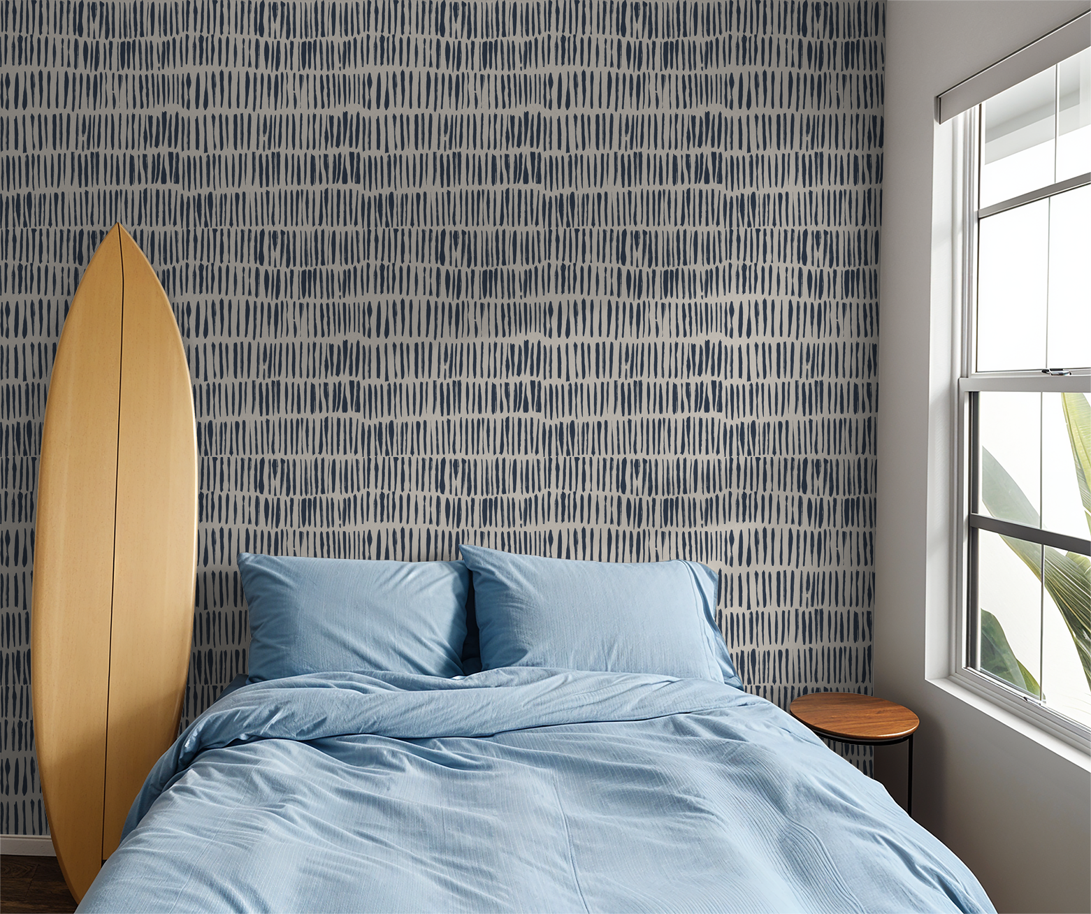Navy brushstroke wallpaper in modern bedroom with surfboard and blue bedding.