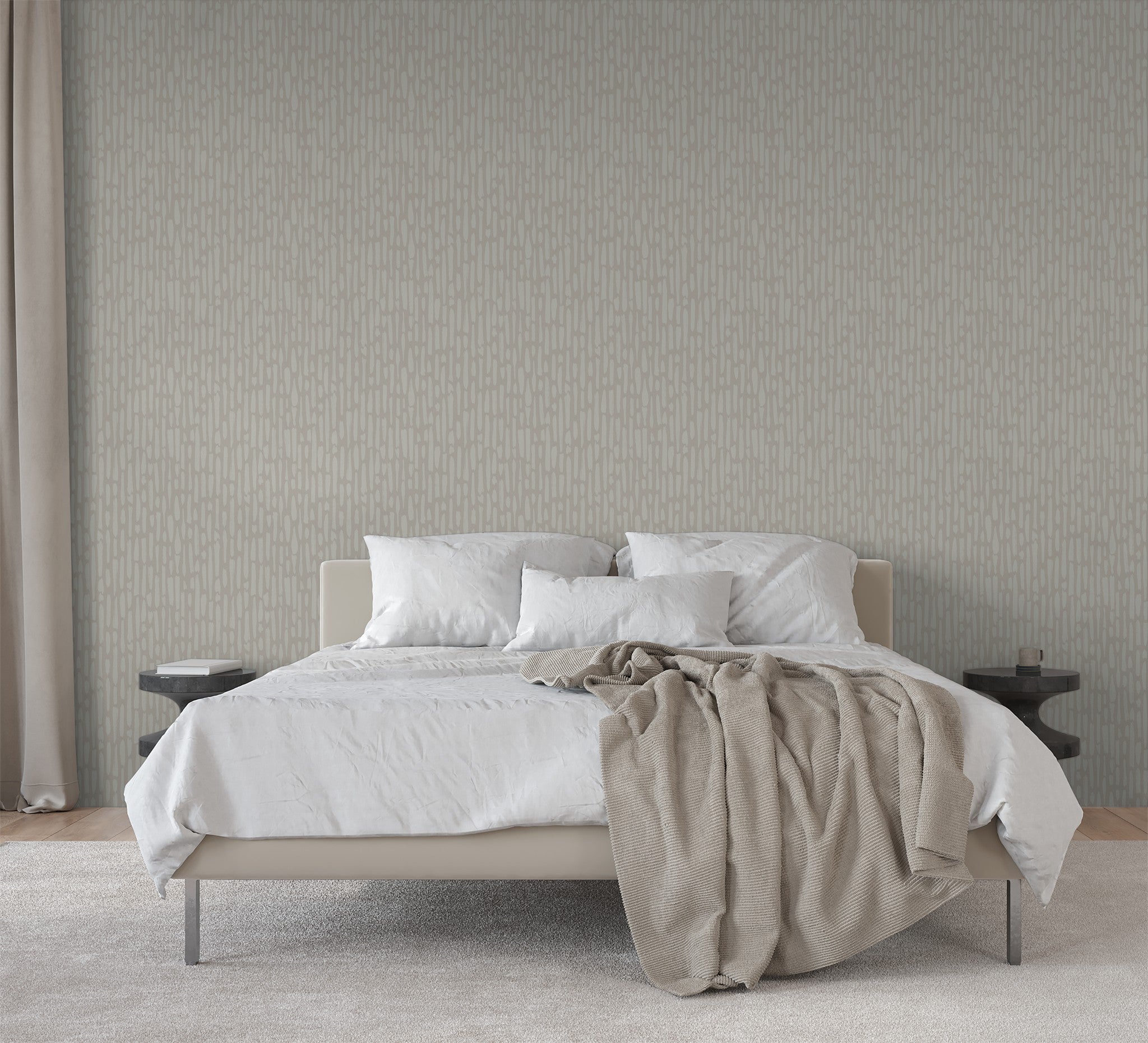 Neutral textured wallpaper in minimalist bedroom with warm layered bedding