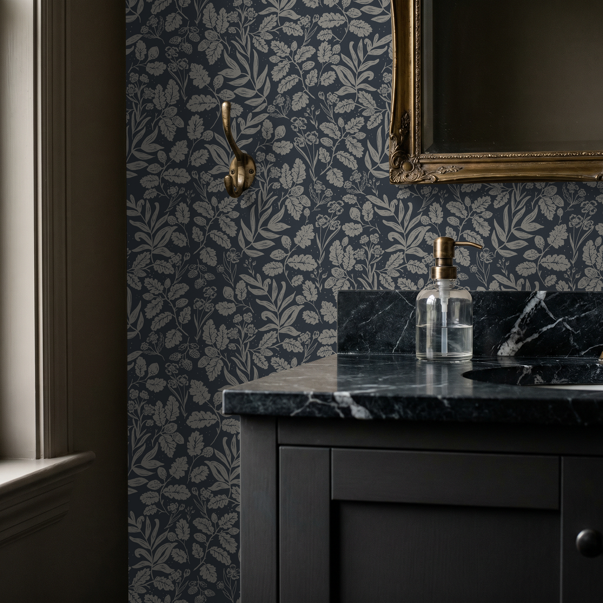 Oak and Acorn Navy wallpaper in a moody bathroom with black marble vanity and brass accents.