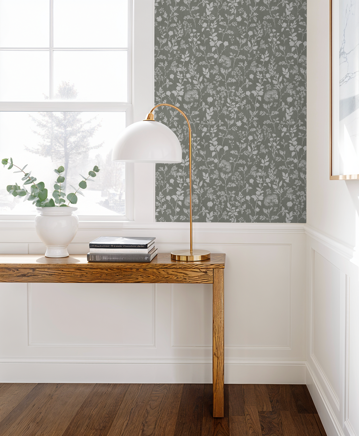 Olive floral wallpaper with white wildflowers in a modern living room setting.